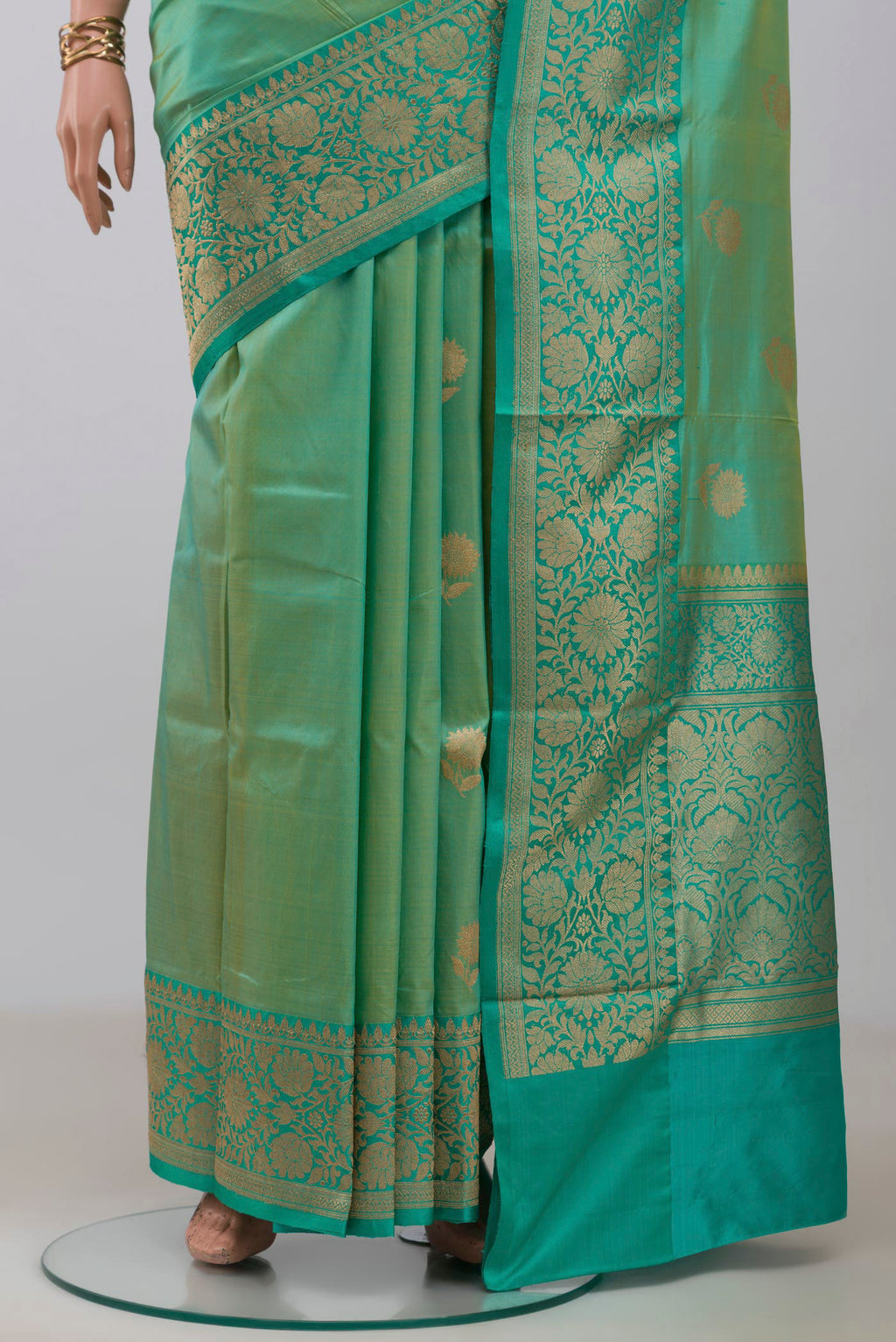 Pleats and pallu of Light Green Banarasi Katan Silk Saree with Zari Butta on the body and Zari Border. 