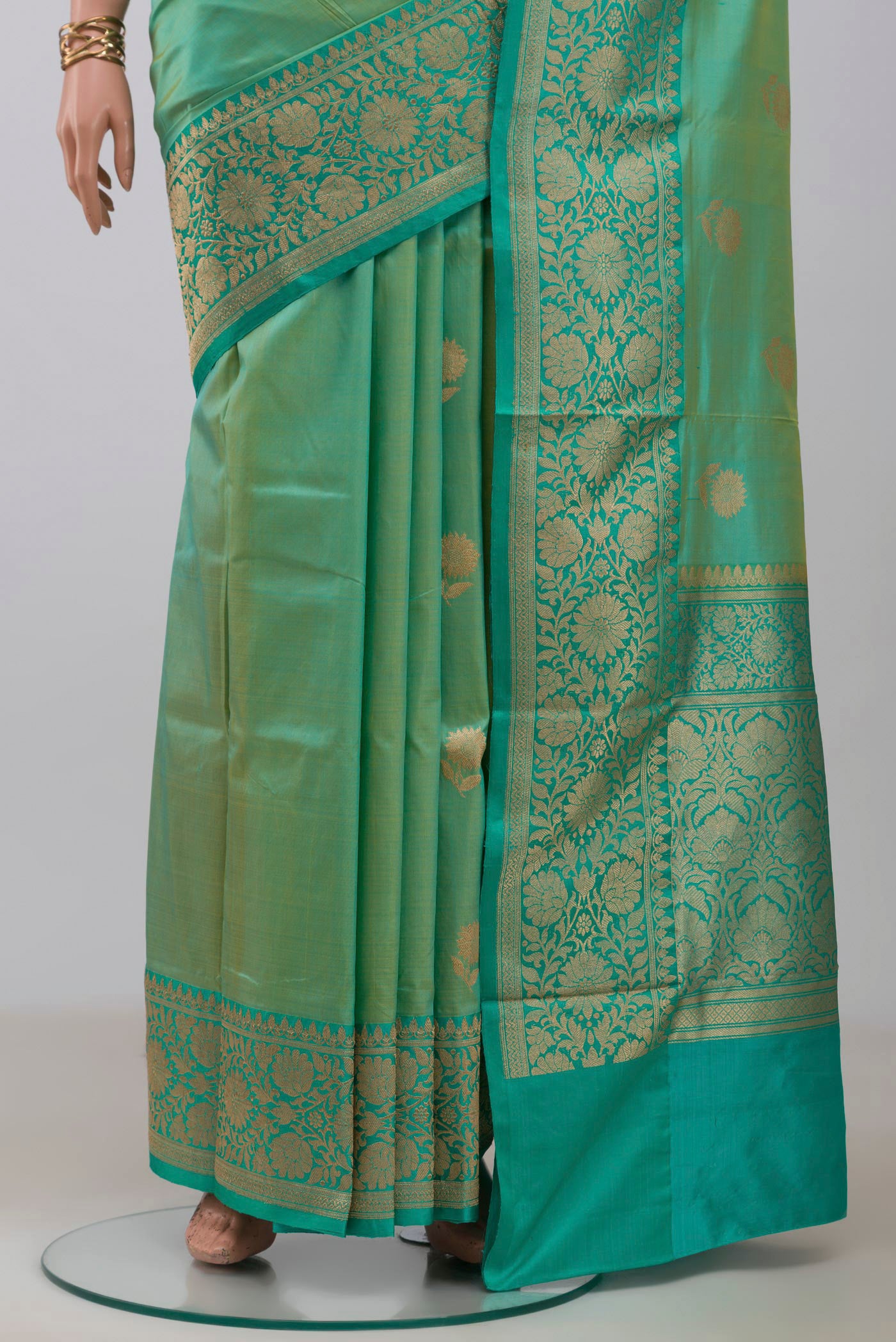 Pleats and pallu of Light Green Banarasi Katan Silk Saree with Zari Butta on the body and Zari Border. 