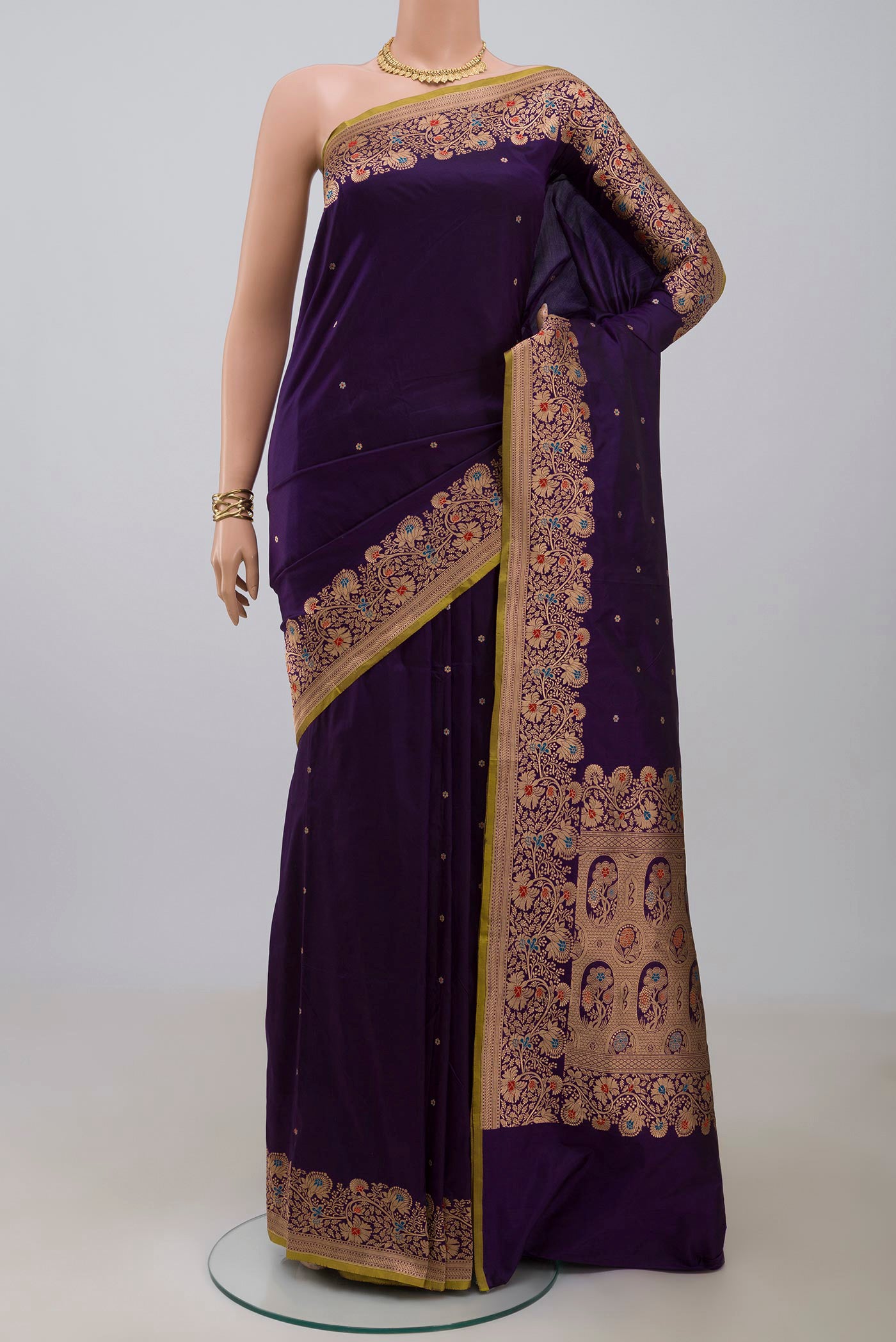 Navy Blue Banarasi Katan Silk Saree with Zari Butta on the body and Zari Border.  displayed on a mannequin