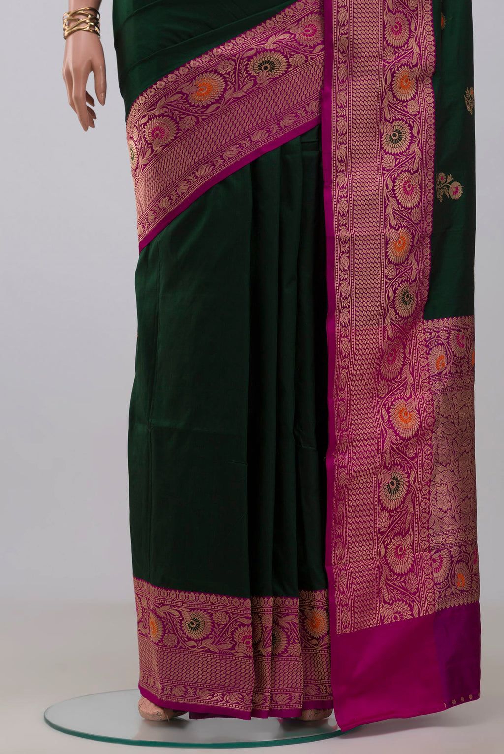 Pleats and pallu of Bottle Green Banarasi Katan Silk Saree with Zari Butta on the body and Fancy Border. 