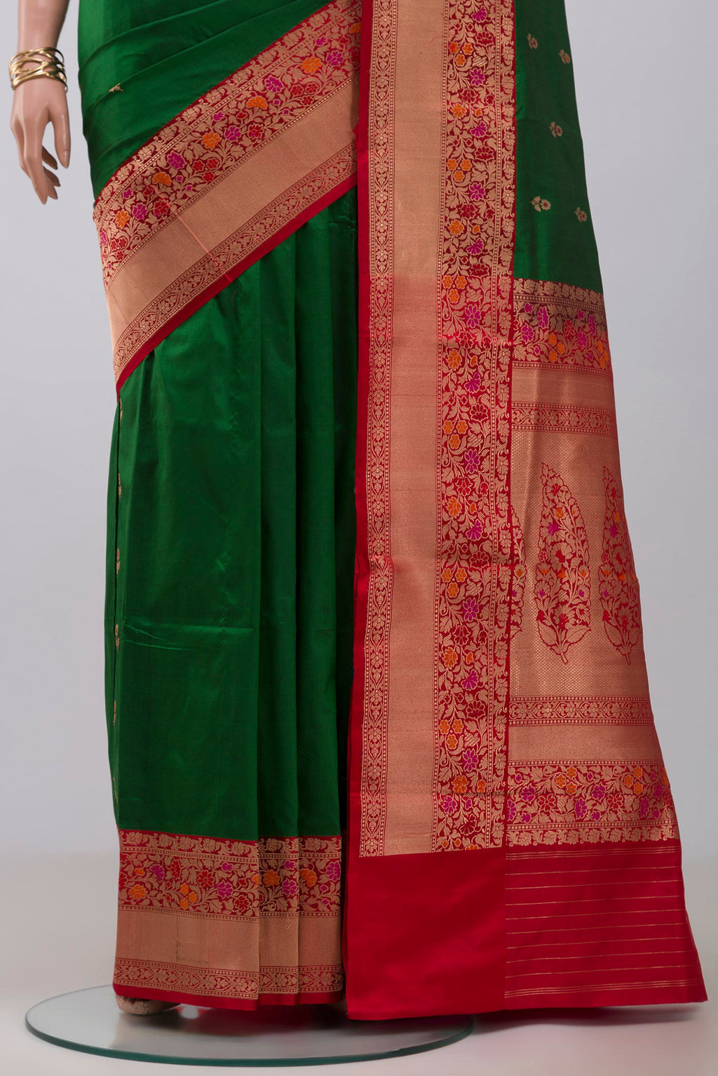 Pleats and pallu of Green Banarasi Katan Silk Saree with Zari Butta on the body and Zari Border. 