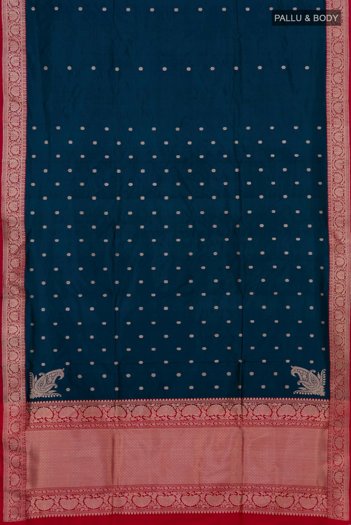 Flat view of Blue Banarasi Katan Silk Saree with Zari Butta on the body and Zari Border. 