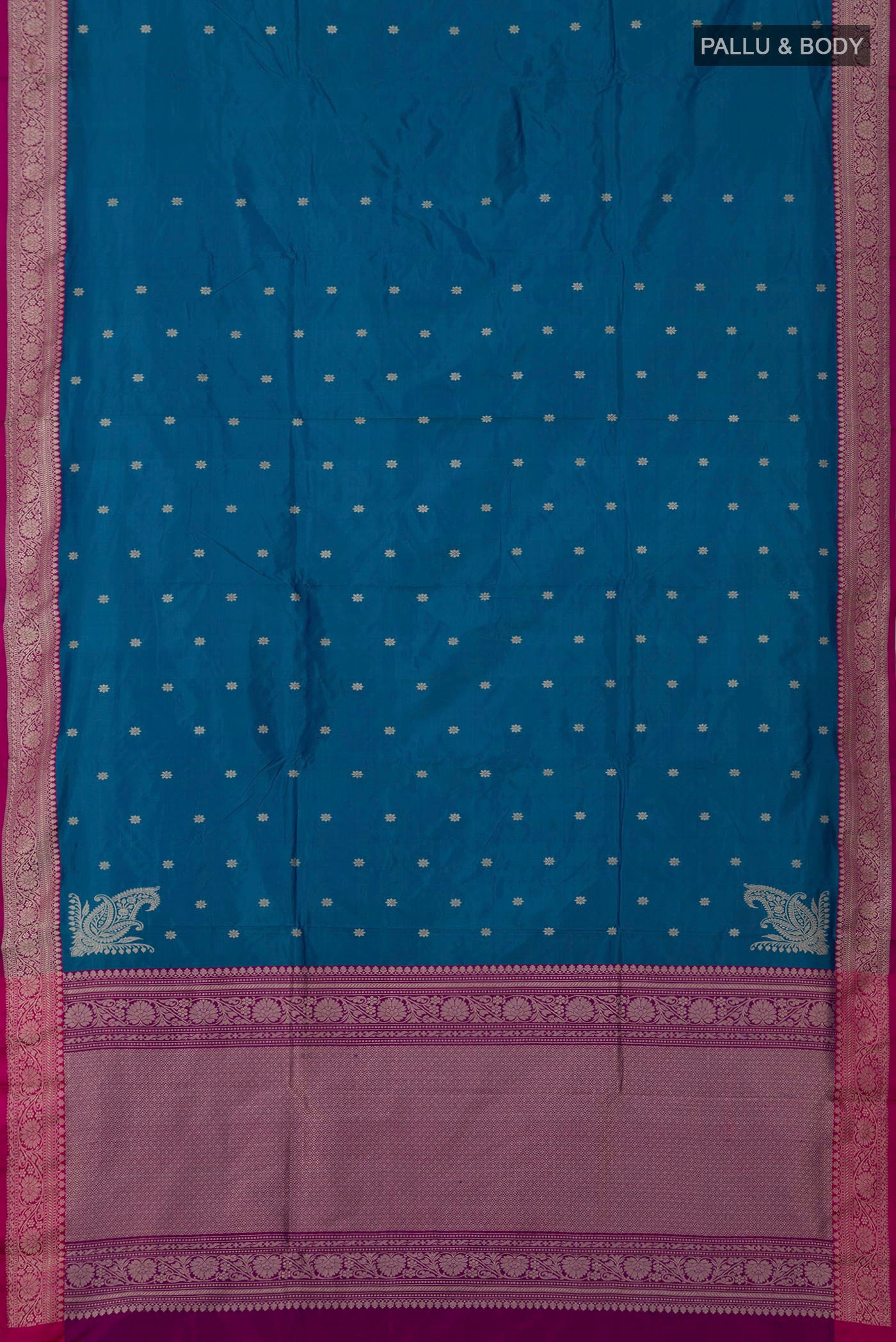 Flat view of Blue Banarasi Katan Silk Saree with Zari Butta on the body and Fancy Border. 