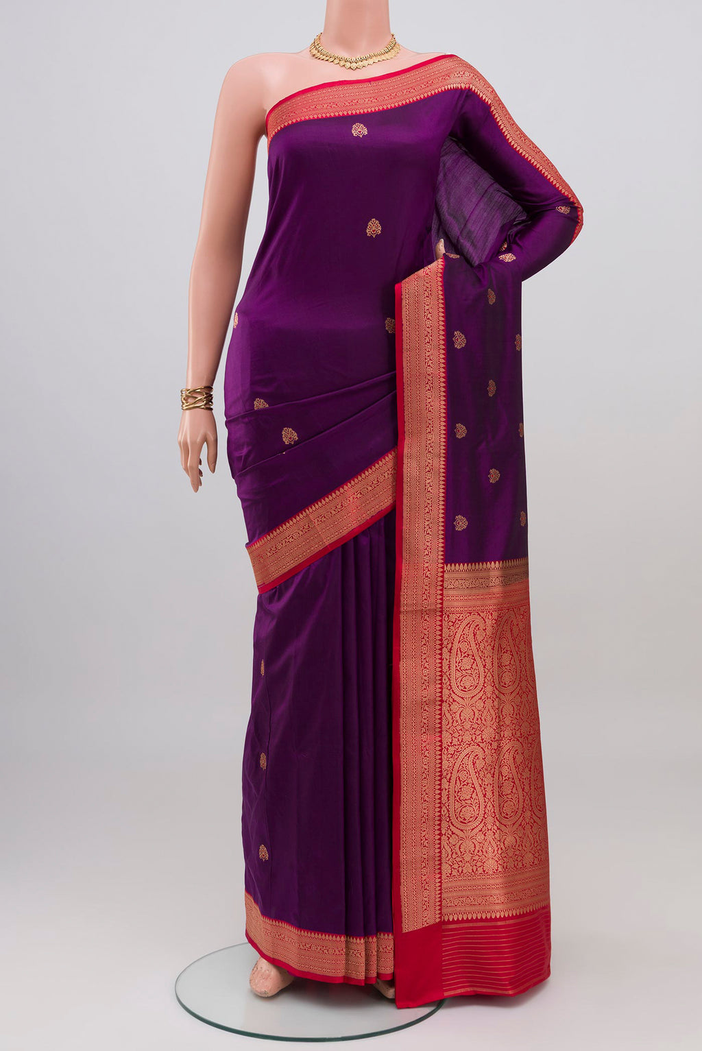 Purple Banarasi Katan Silk Saree with Zari Butta on the body and Zari Border.  displayed on a mannequin