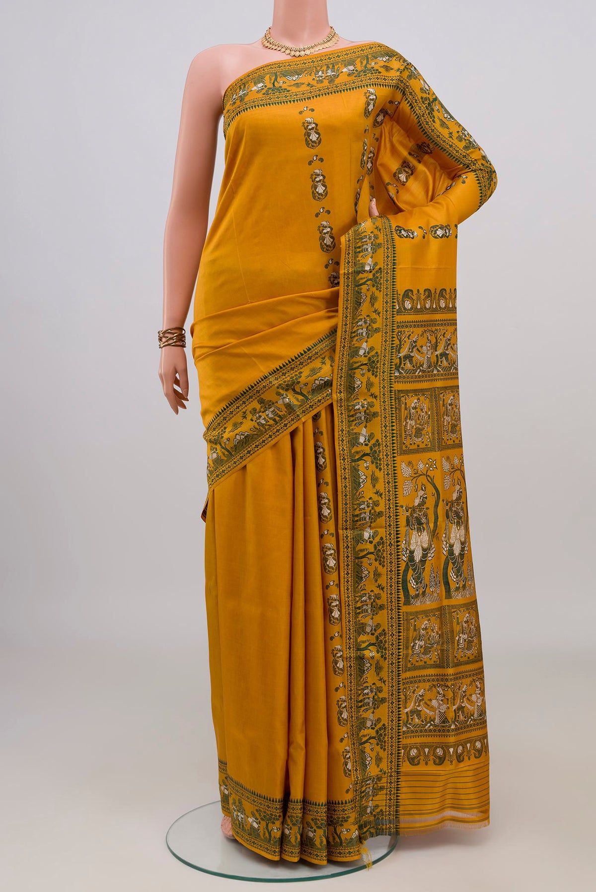 Pure Silk Mustard Baluchari Saree with Thread Butta on the body and Thread Border.  displayed on a mannequin