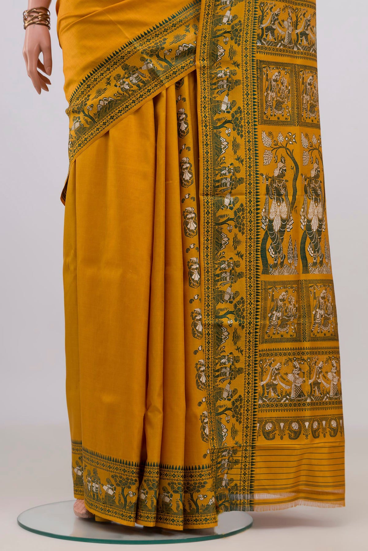 Pleats and pallu of Pure Silk Mustard Baluchari Saree with Thread Butta on the body and Thread Border. 