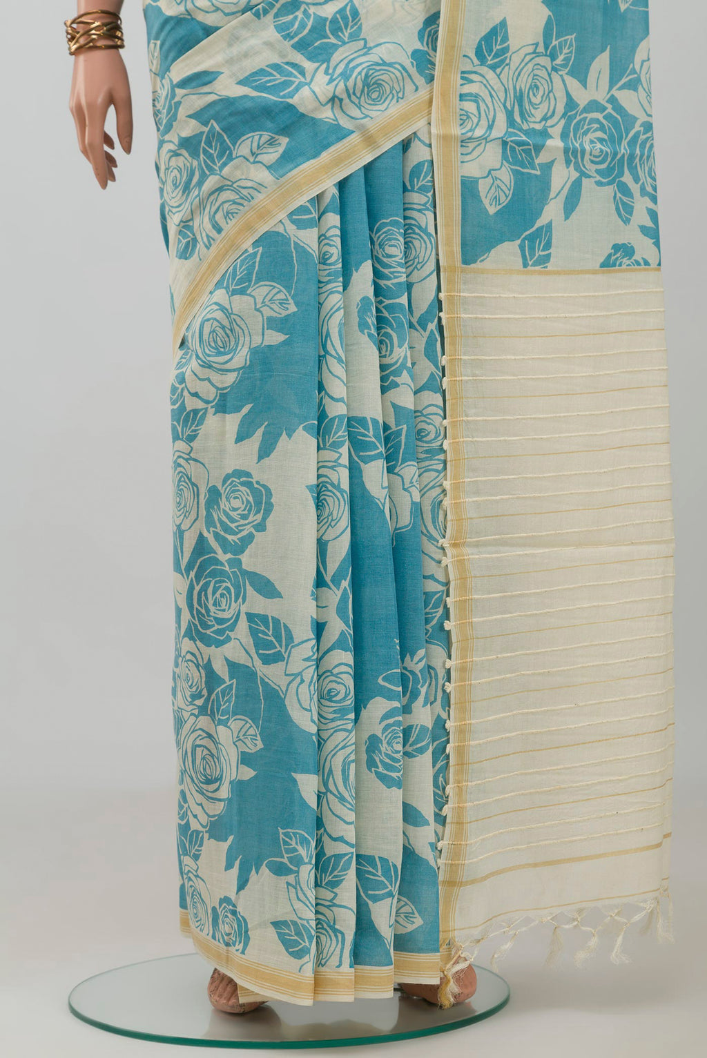 Pleats and pallu of Cream Tussar Silk Saree with Floral Print on the body and Plain Border. 