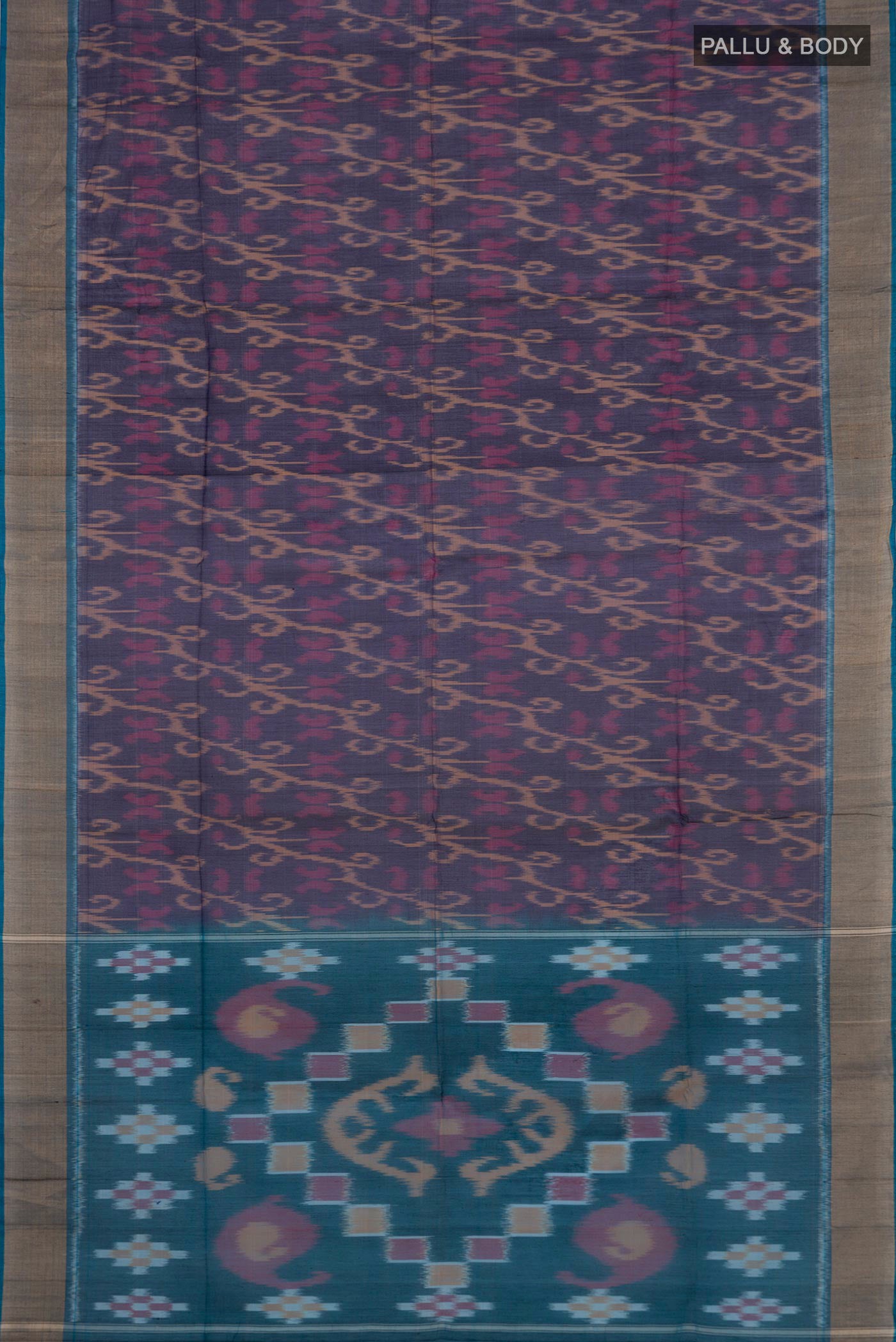 Flat view of Navy Blue Silk Cotton Saree with Ikat design on the body and Zari Border. 