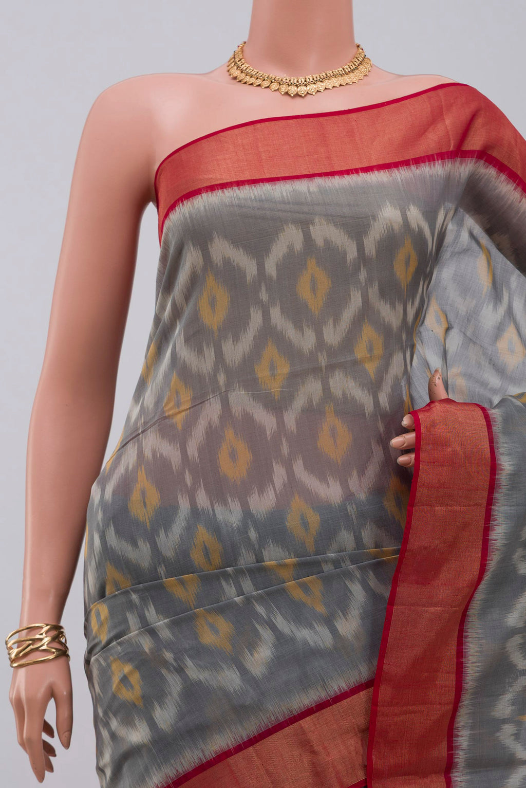 Border image of Grey Coimbatore Silk Cotton Saree with Ikat design on the body and Zari Border. 