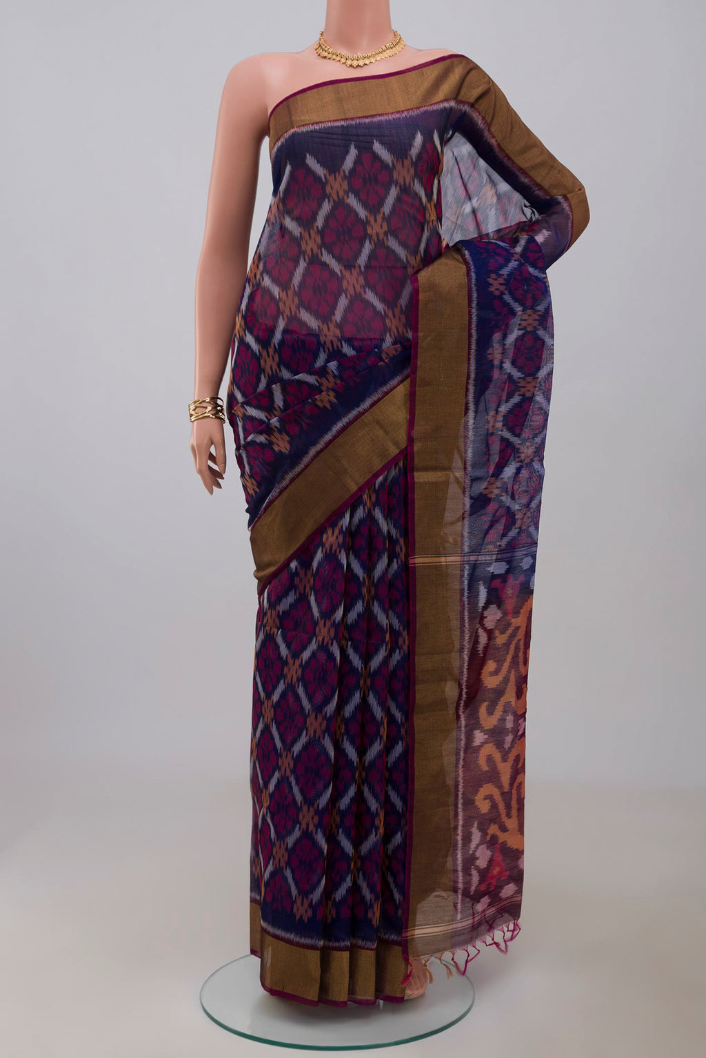 Blue Silk Cotton Saree with Ikat Print on the body and Zari Border.  displayed on a mannequin
