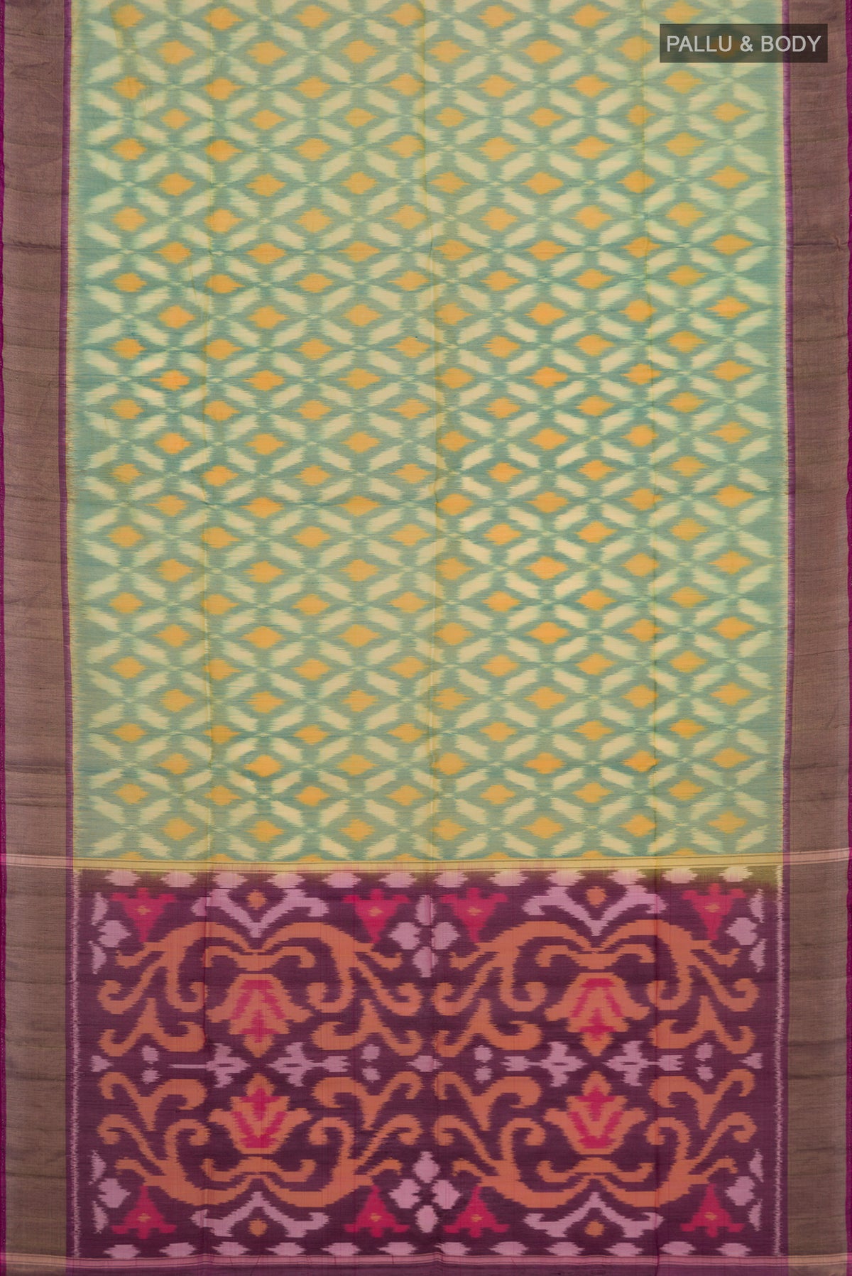 Flat view of Green Silk Cotton Saree with Ikat design on the body and Zari Border. 