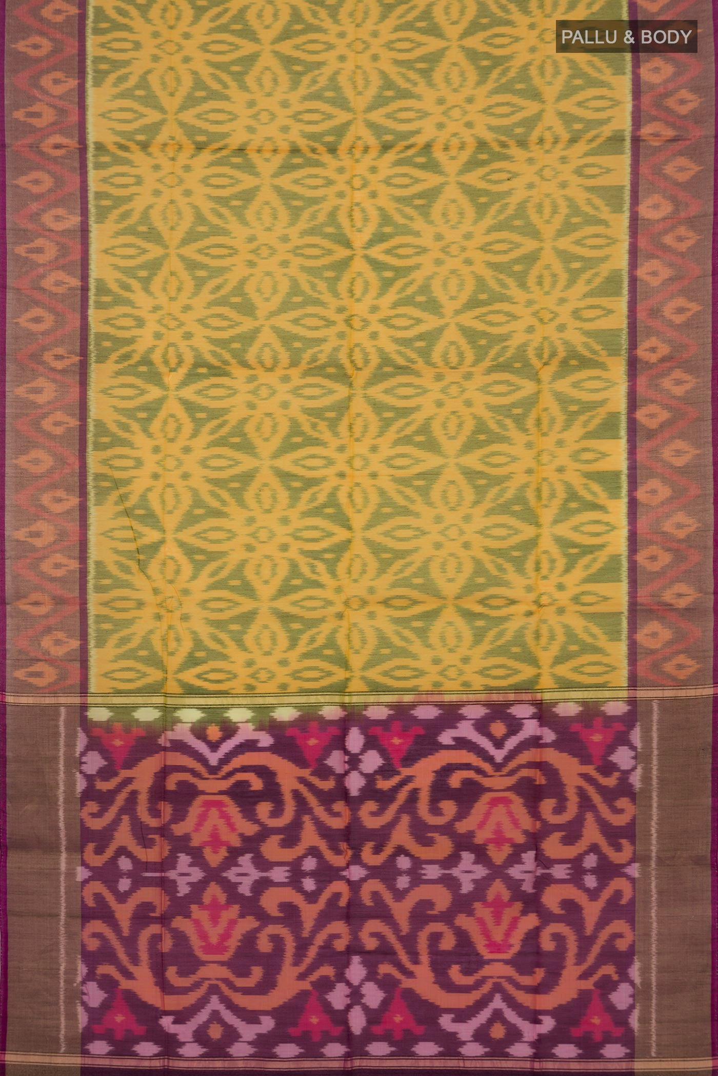 Flat view of Yellow Silk Cotton Saree with Ikat design on the body and Zari Border. 