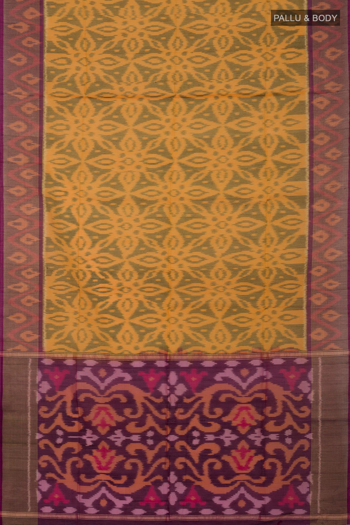 Flat view of Yellow Silk Cotton Saree with Ikat Print on the body and Zari Border. 