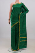 Pure Silk Green Kanjivaram Saree with Checked design on the body and Zari Border.  displayed on a mannequin