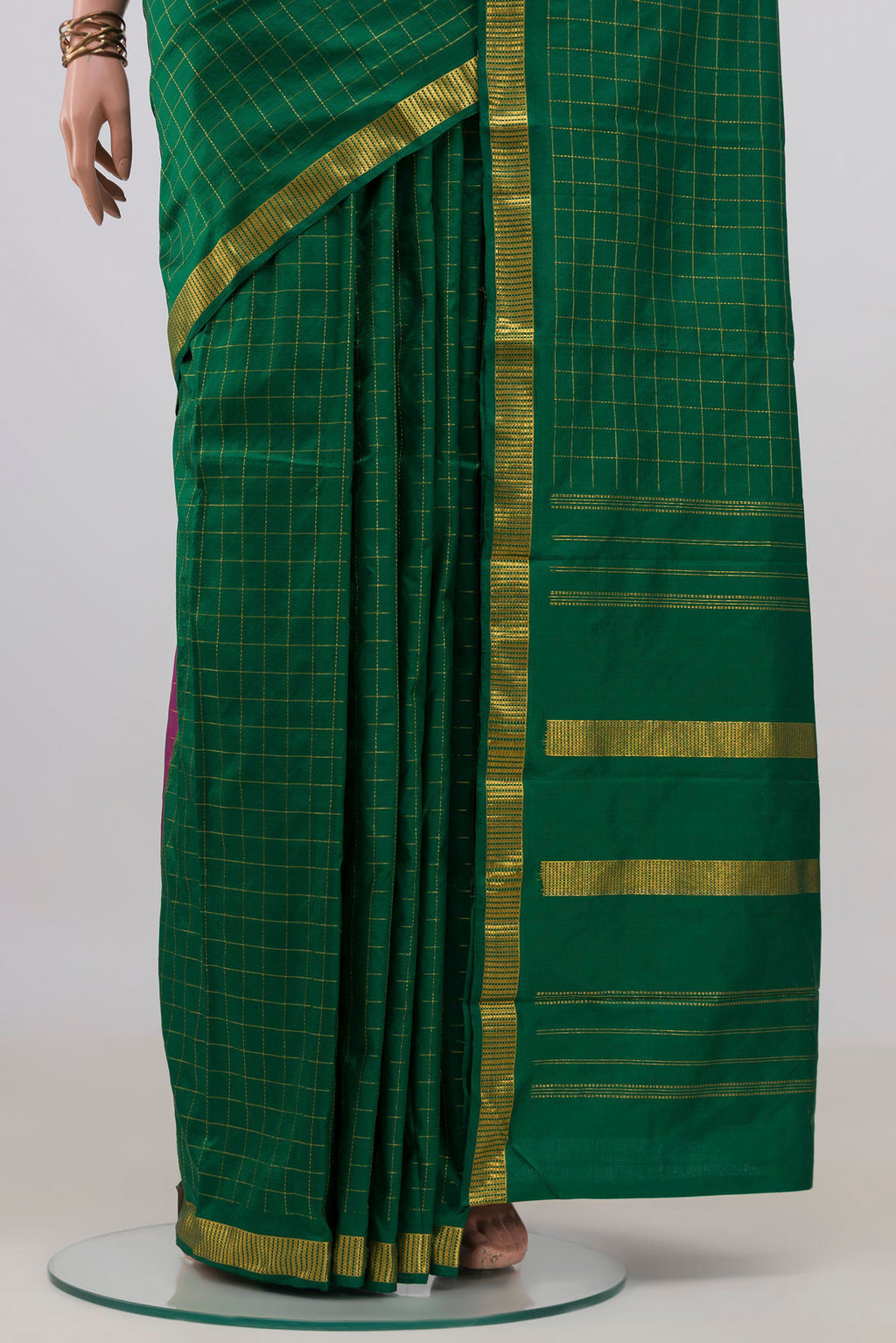 Pleats and pallu of Pure Silk Green Kanjivaram Saree with Checked design on the body and Zari Border. 