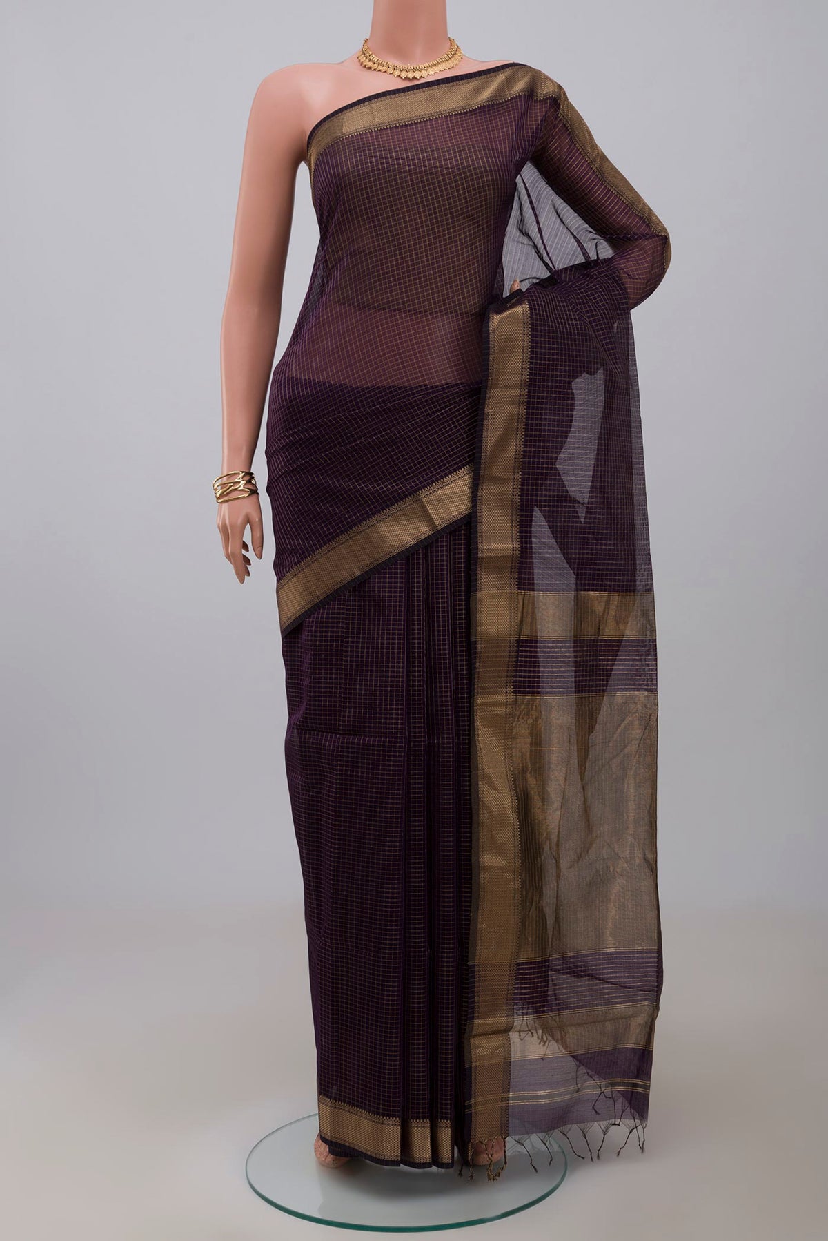 Purple Maheshwari Silk Cotton Saree with Stripes on the body and Zari Border.  displayed on a mannequin