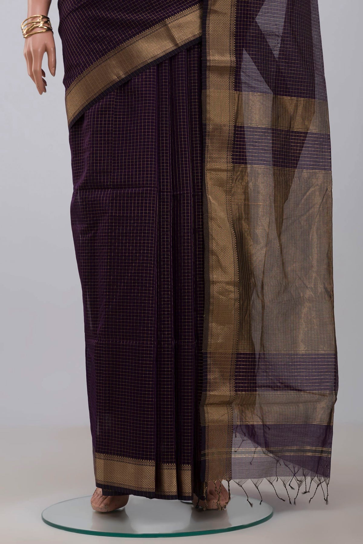 Pleats and pallu of Purple Maheshwari Silk Cotton Saree with Stripes on the body and Zari Border. 