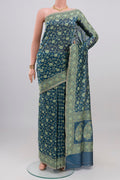 Blue Grey Banarasi Silk Saree with Zari And Thread Butta on the body and Zari Border.  displayed on a mannequin