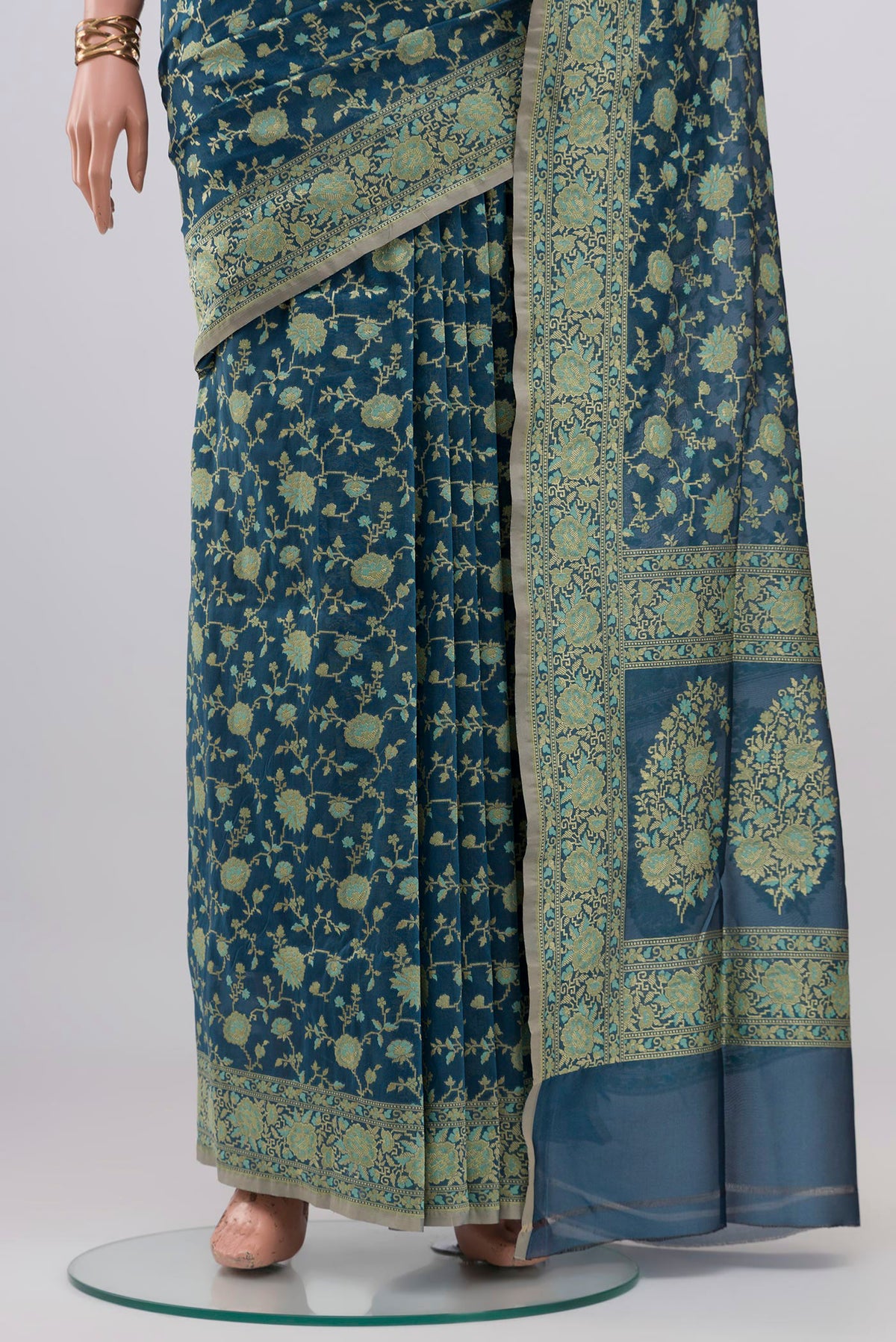 Pleats and pallu of Blue Grey Banarasi Silk Saree with Zari And Thread Butta on the body and Zari Border. 