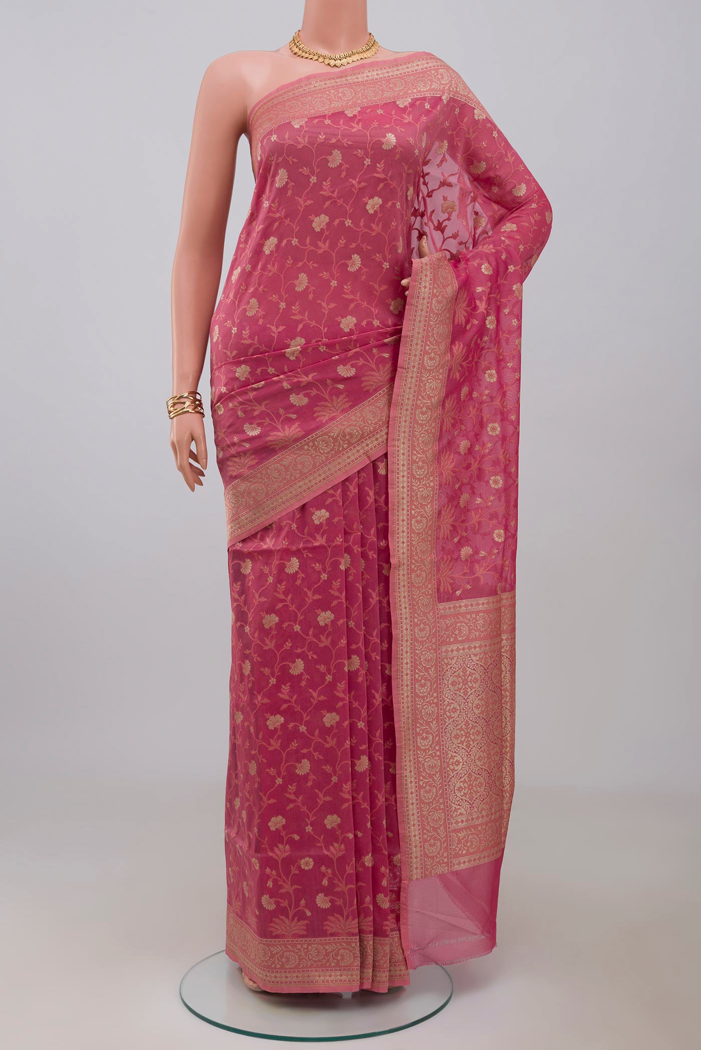 Pink Banarasi Saree with Fancy on the body and Fancy Border.  displayed on a mannequin