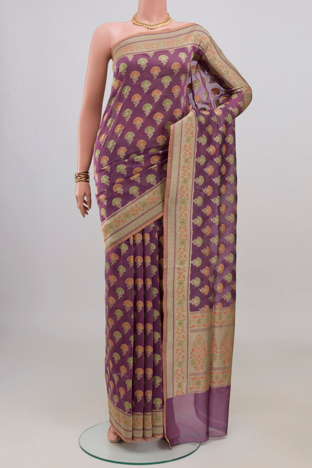 Pure Silk Mauve Banarasi Saree with Thread Butta on the body and Zari Border.  displayed on a mannequin