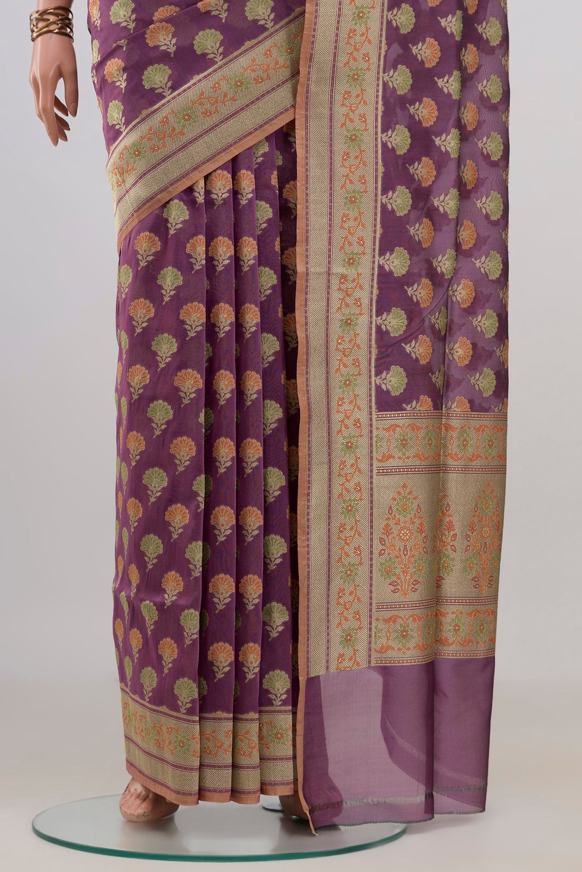 Pleats and pallu of Pure Silk Mauve Banarasi Saree with Thread Butta on the body and Zari Border. 