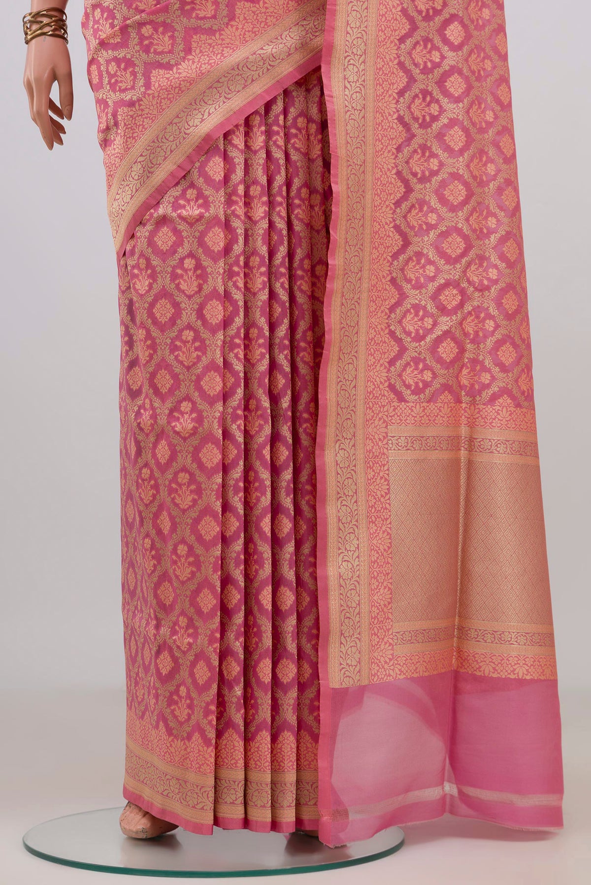 Pleats and pallu of Pure Silk Pink Banarasi Saree with Zari And Thread Butta on the body and Zari Border. 