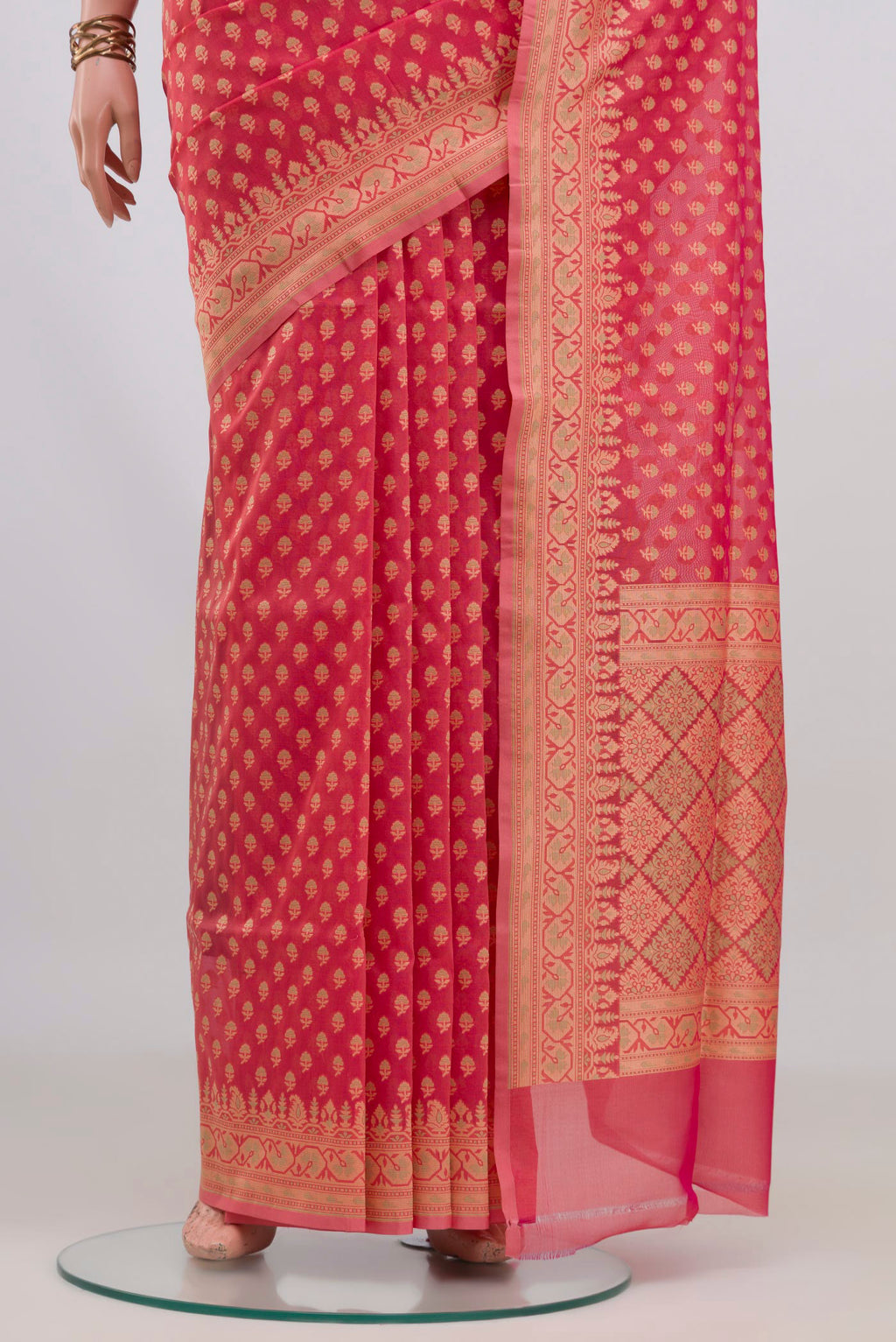 Pleats and pallu of Pure Silk Coral Banarasi Saree with Zari And Thread Butta on the body and Zari Border. 