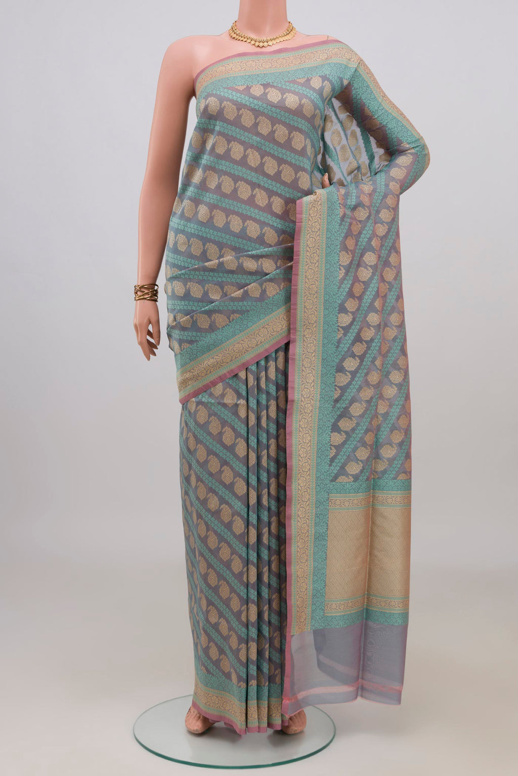 Pure Silk Blue Grey Banarasi Saree with Thread Butta on the body and Zari Border.  displayed on a mannequin