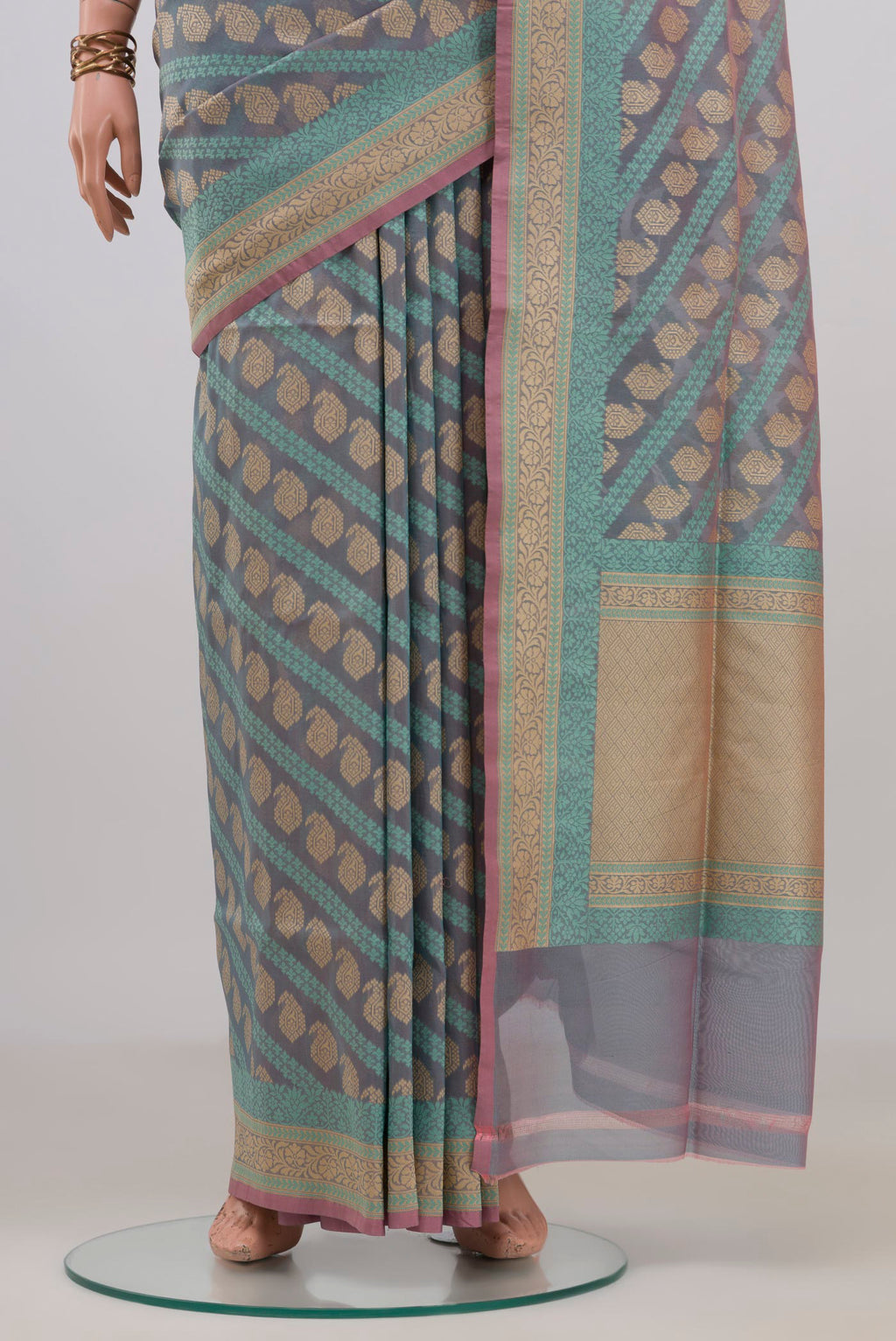 Pleats and pallu of Pure Silk Blue Grey Banarasi Saree with Thread Butta on the body and Zari Border. 