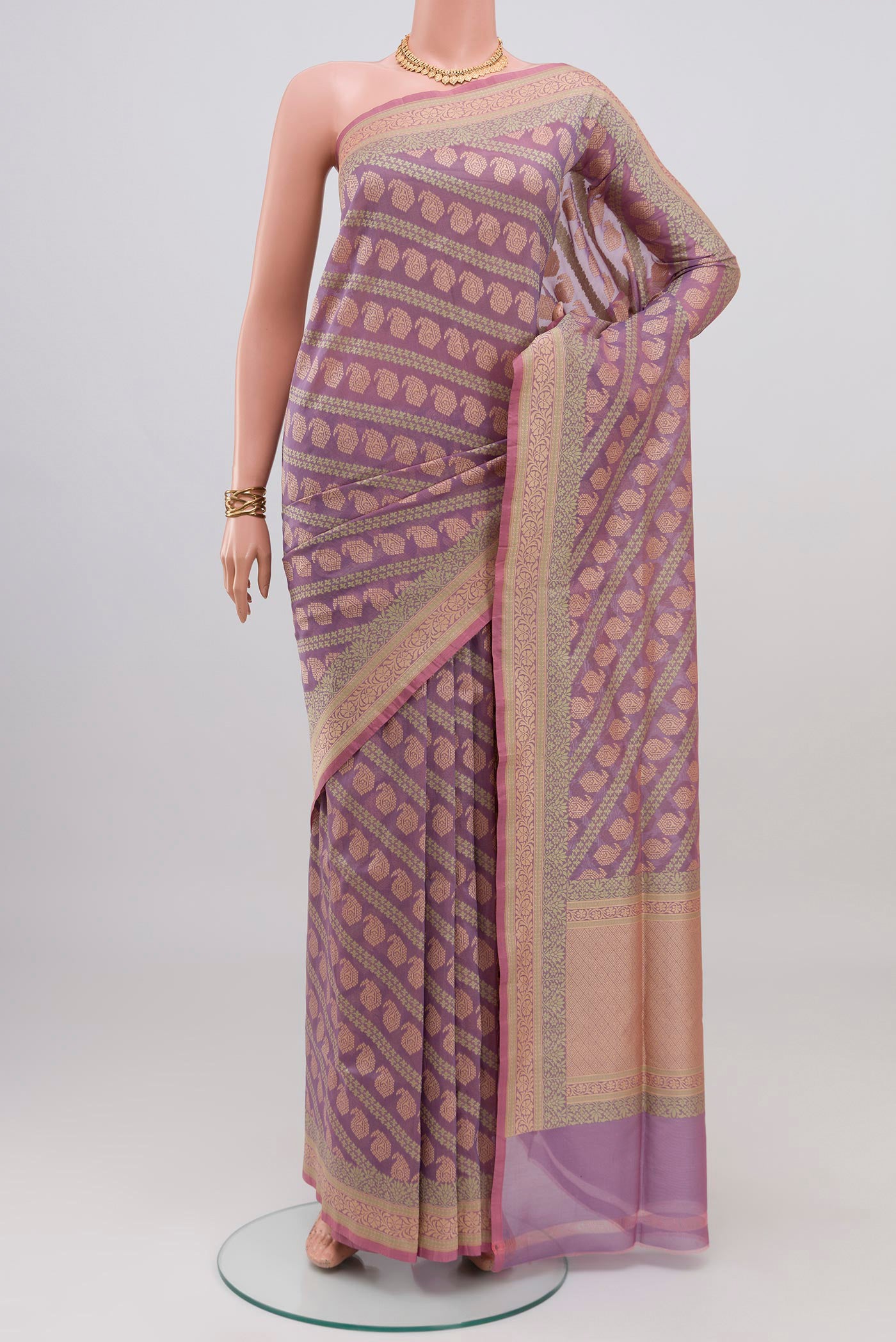 Lavender Banarasi Silk Saree with Zari And Thread Butta on the body and Fancy Border.  displayed on a mannequin