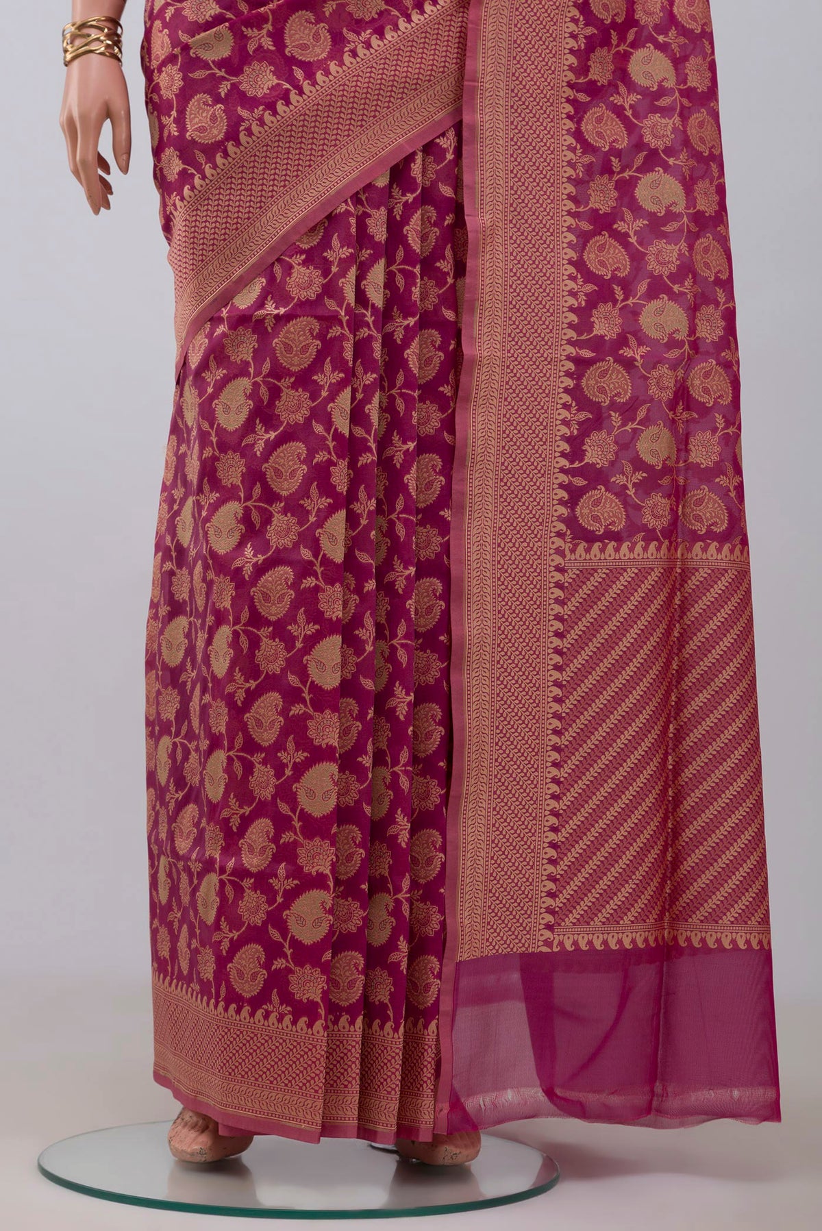 Pleats and pallu of Rani Pink Banarasi Silk Saree with Zari Brocade on the body and Zari Border. 