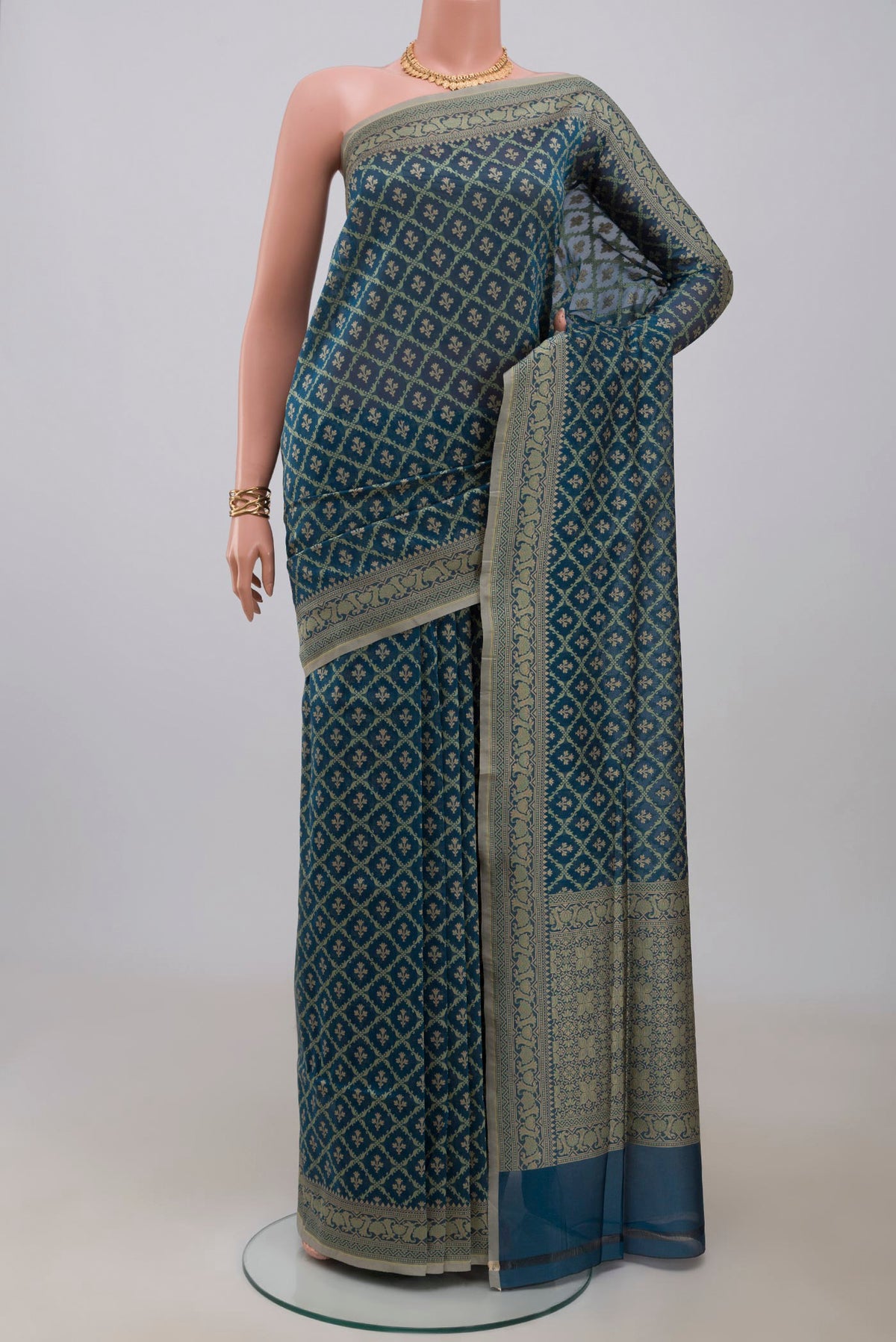 Blue Banarasi Saree with Fancy on the body and Fancy Border.  displayed on a mannequin