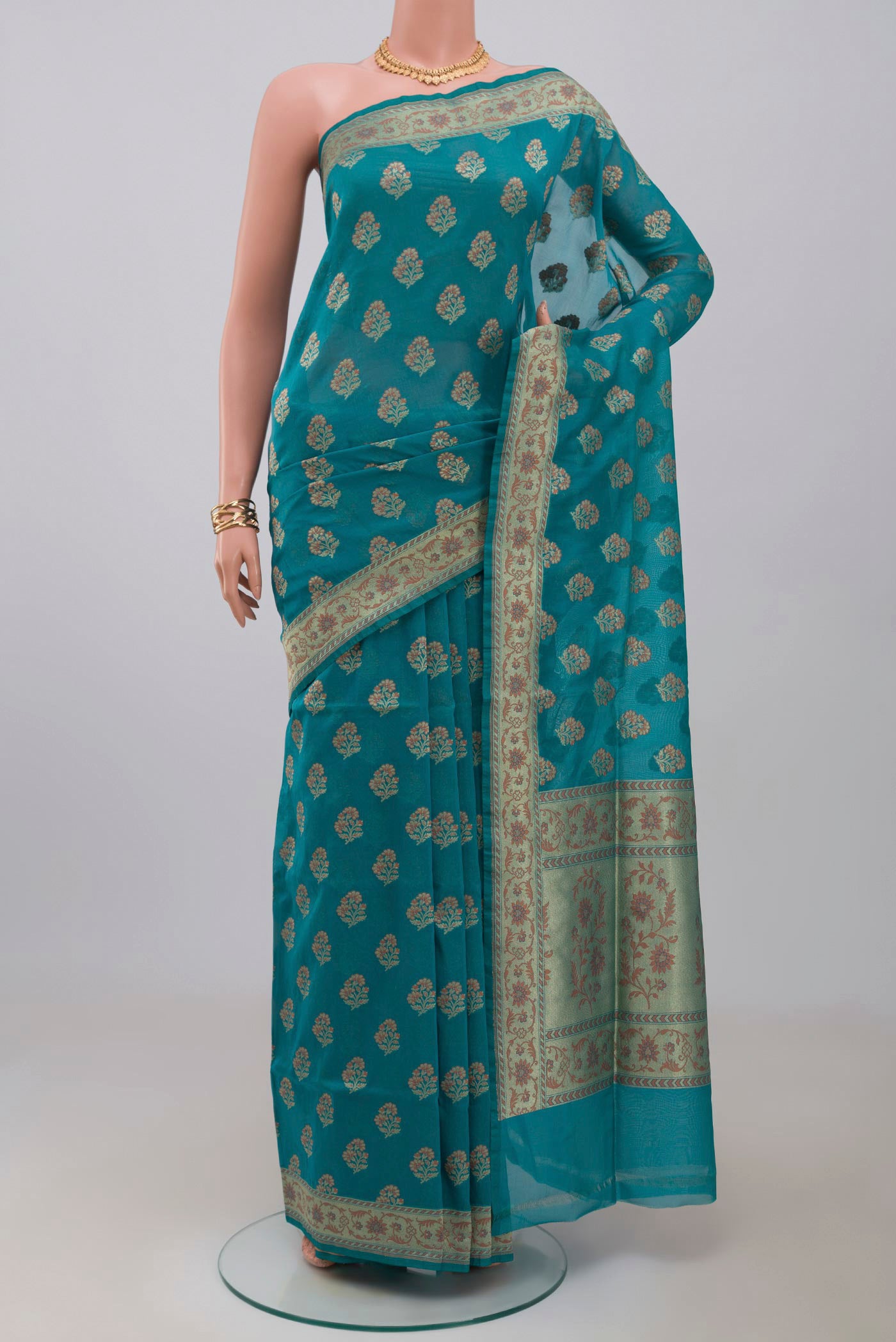 Blue Banarasi Saree with Zari Butta on the body and Fancy Border.  displayed on a mannequin