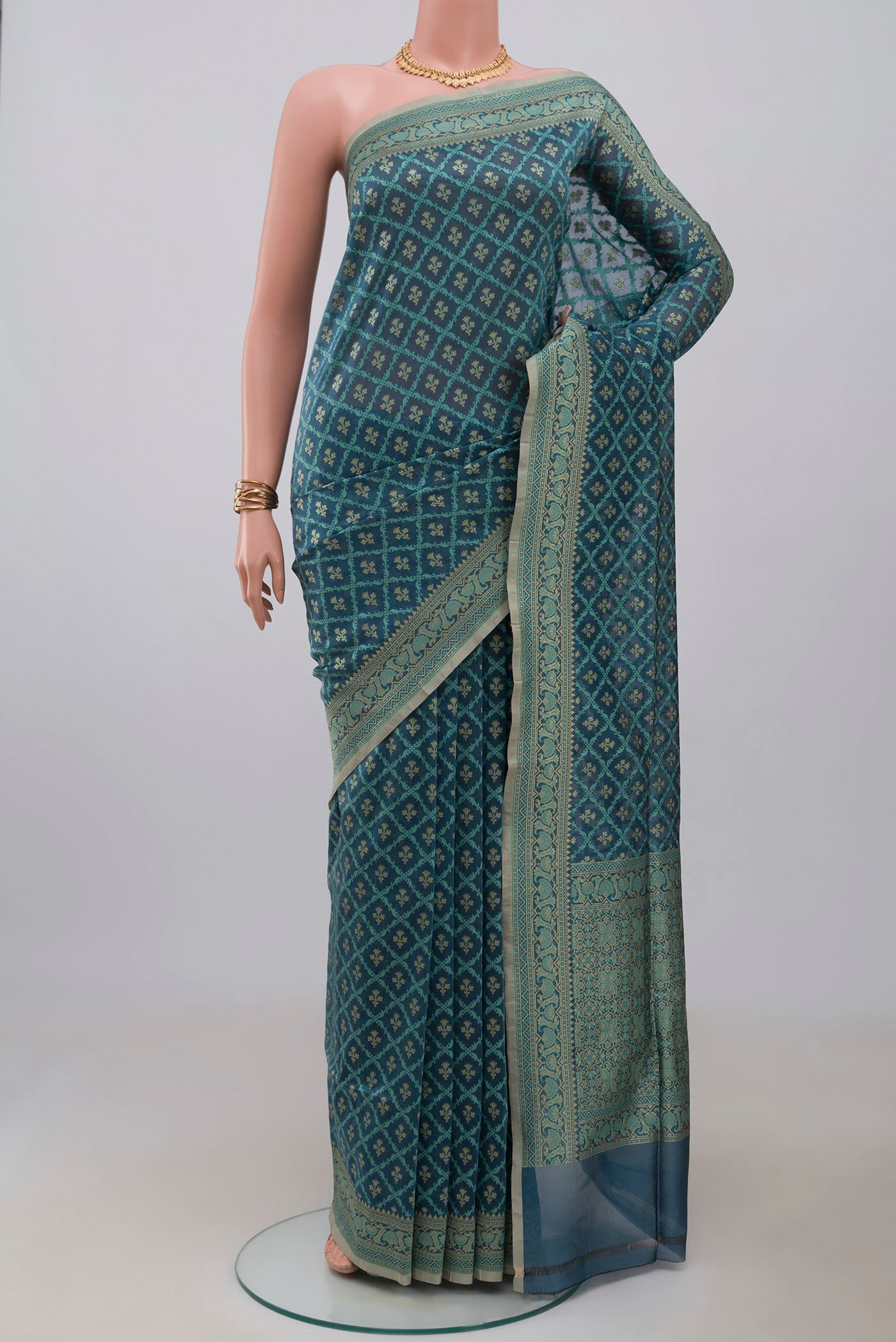 Blue Grey Banarasi Silk Saree with Zari And Thread Butta on the body and Zari Border.  displayed on a mannequin