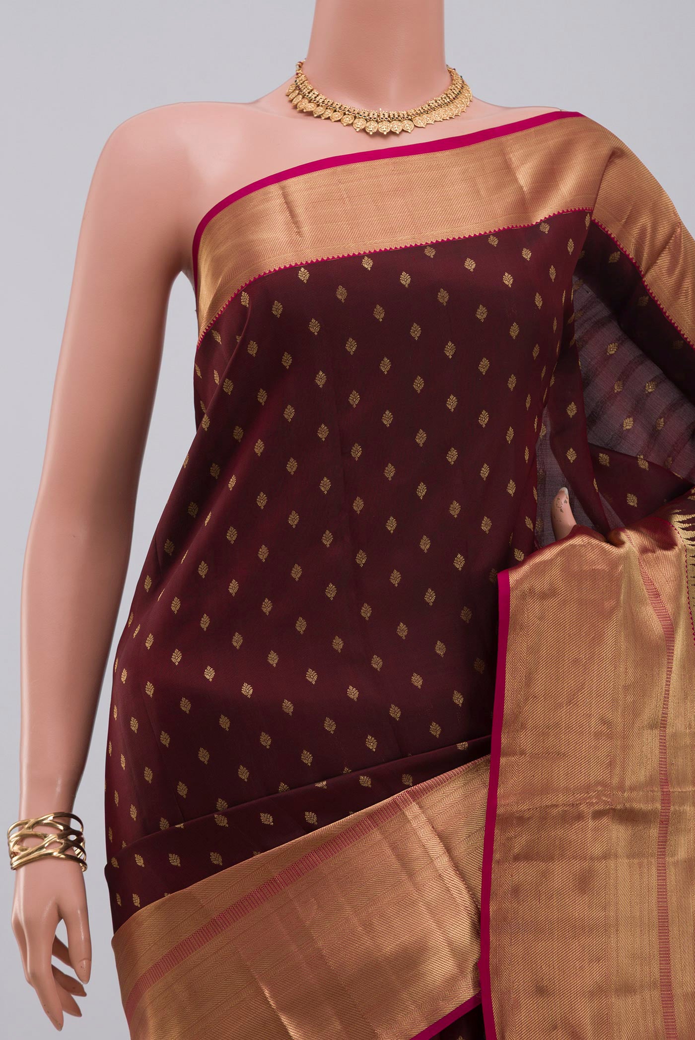 Border image of Brown Kanchipuram Silk Saree with Zari Butta on the body and Zari Border. 
