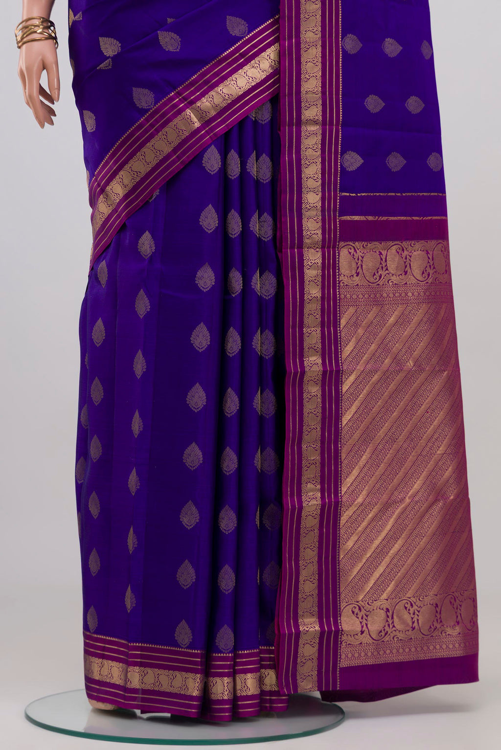 Pleats and pallu of Blue Kanchipuram Silk Saree with Zari Butta on the body and Zari Border. 