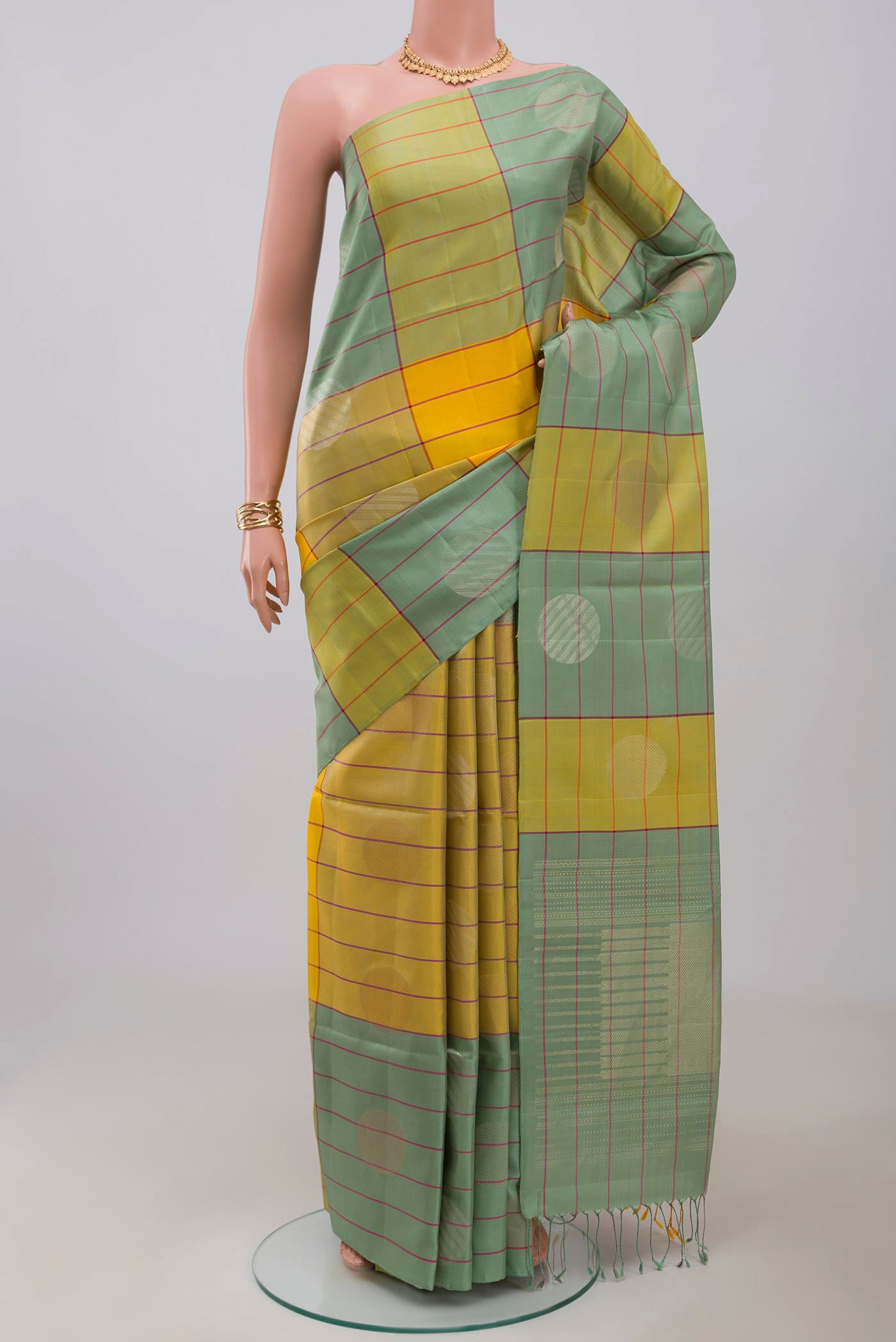 Multi Color Soft Silk Saree with Checked design on the body and Without Border.  displayed on a mannequin