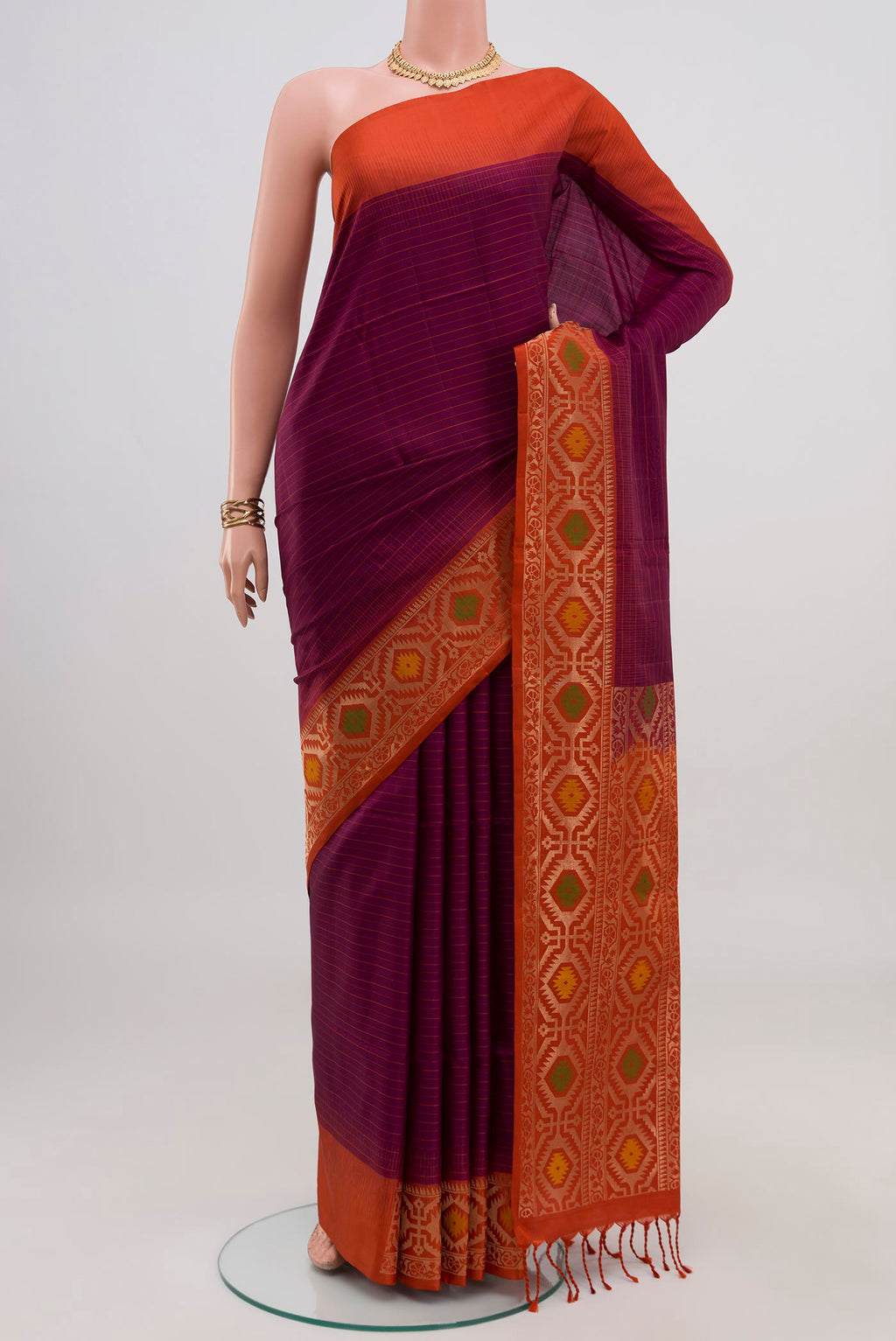 Purple Soft Silk Saree with Fancy on the body and Fancy Border.  displayed on a mannequin