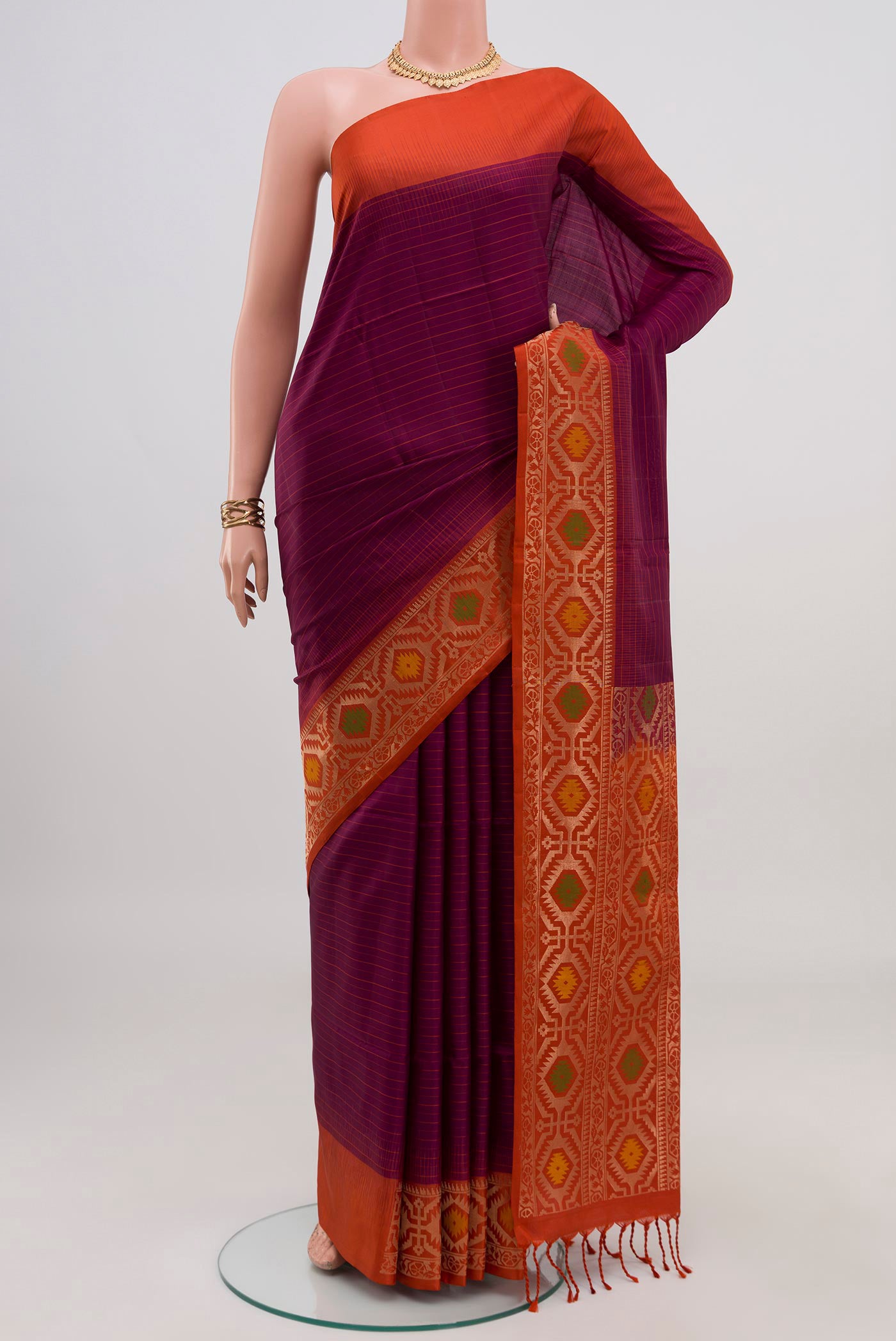 Purple Soft Silk Saree with Fancy on the body and Fancy Border.  displayed on a mannequin