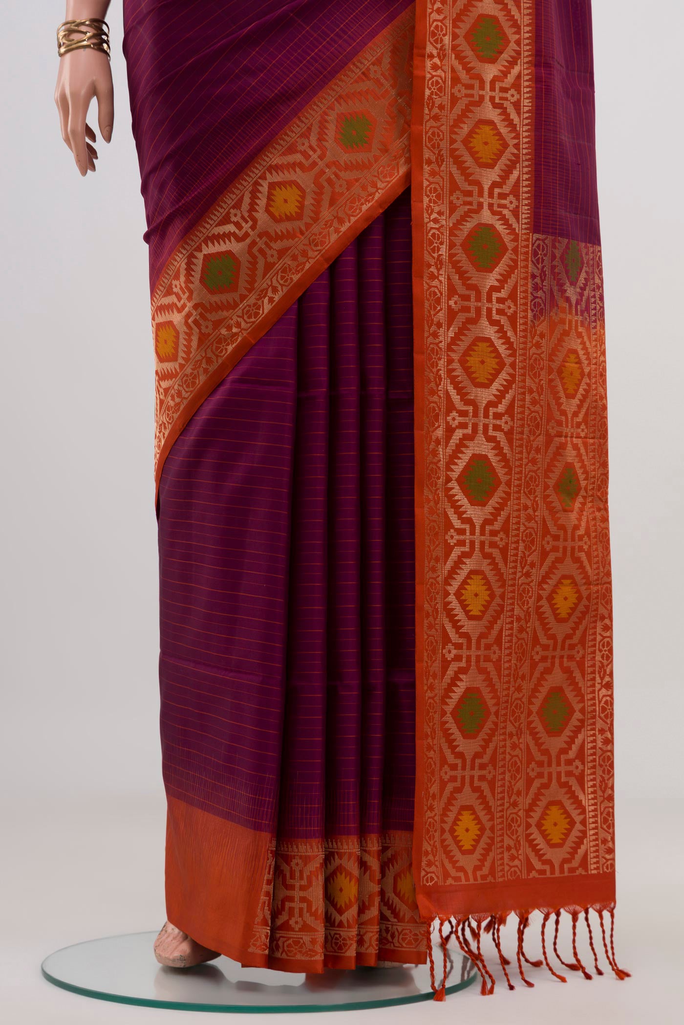 Pleats and pallu of Purple Soft Silk Saree with Fancy on the body and Fancy Border. 