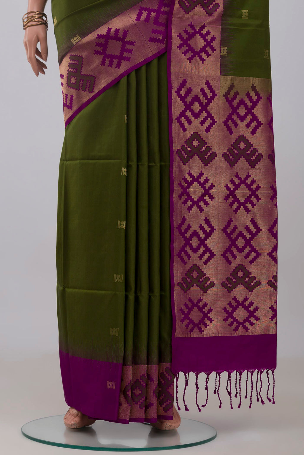 Pleats and pallu of Green Soft Silk Saree with Zari Butta on the body and Fancy Border. 