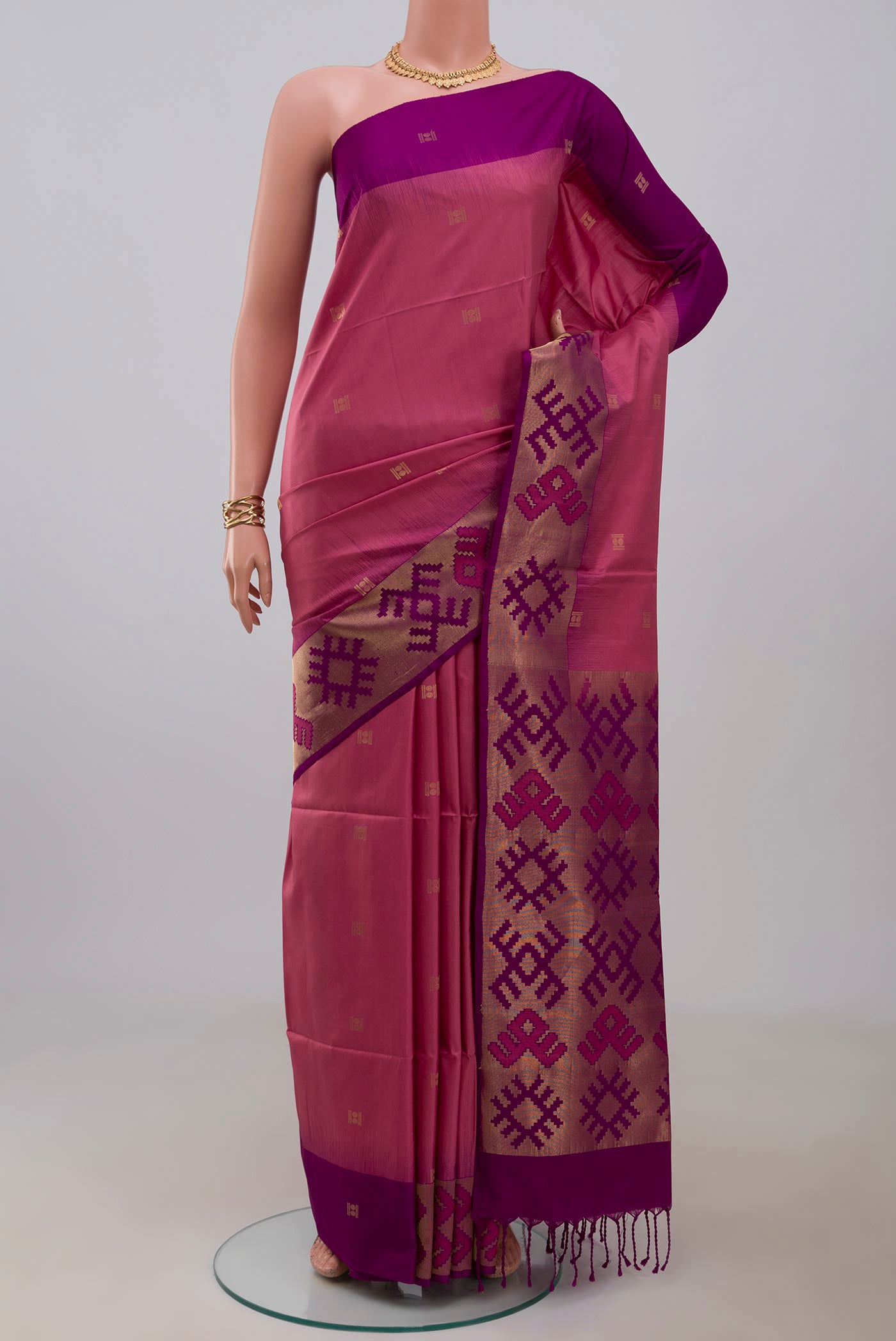 Pink Soft Silk Saree with Zari Butta on the body and Fancy Border.  displayed on a mannequin