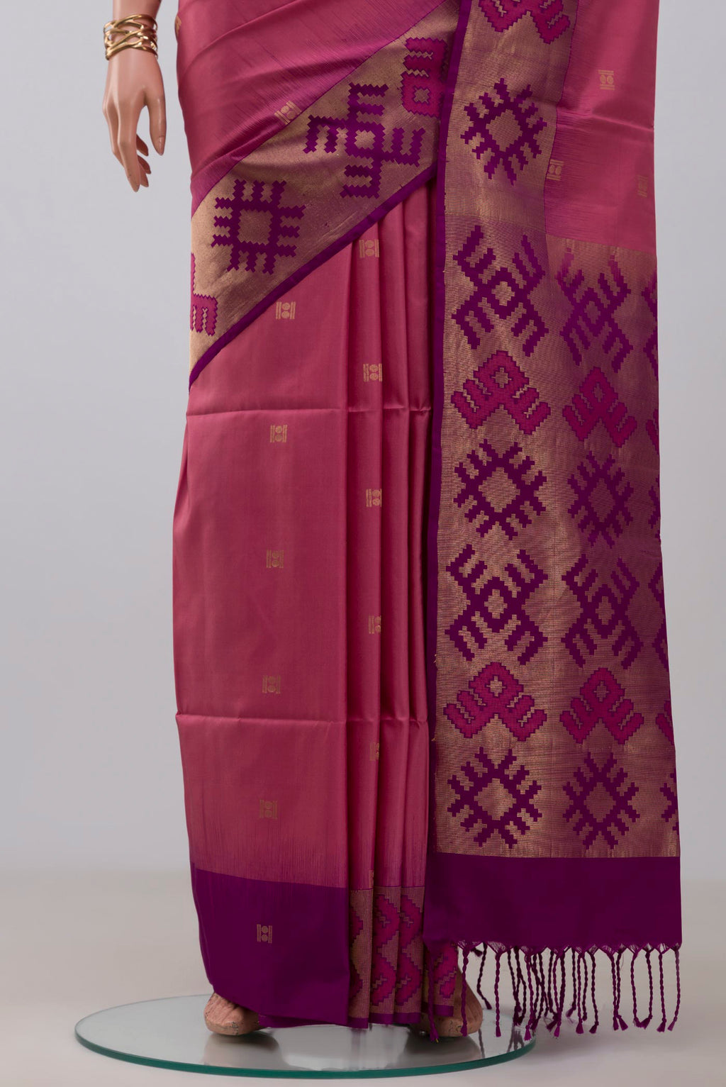 Pleats and pallu of Pink Soft Silk Saree with Zari Butta on the body and Fancy Border. 