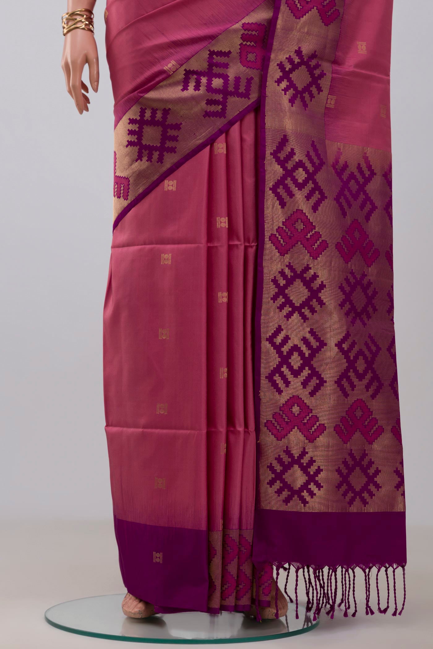 Pleats and pallu of Pink Soft Silk Saree with Zari Butta on the body and Fancy Border. 