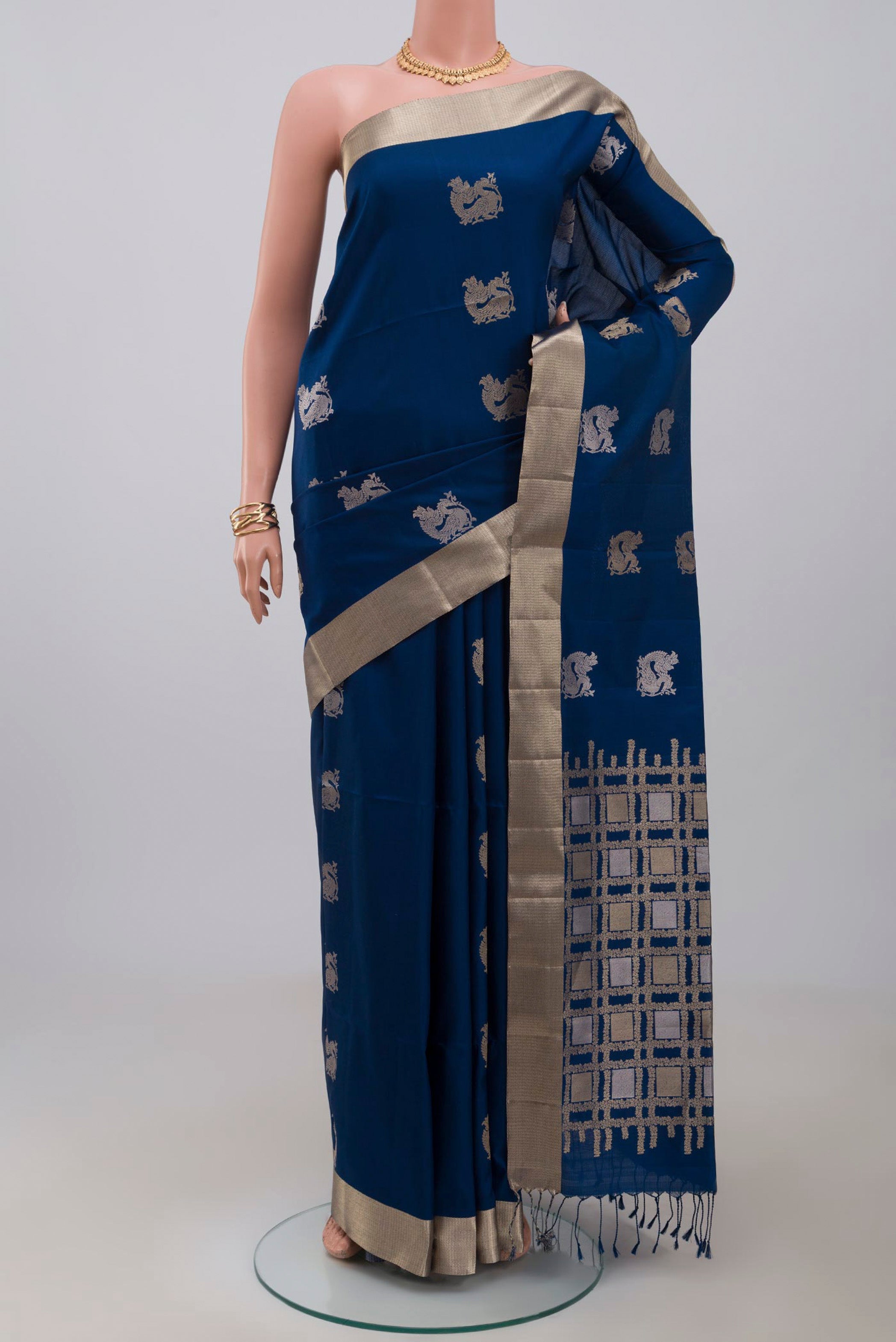 Blue Soft Silk Saree with Zari Butta on the body and Zari Border.  displayed on a mannequin