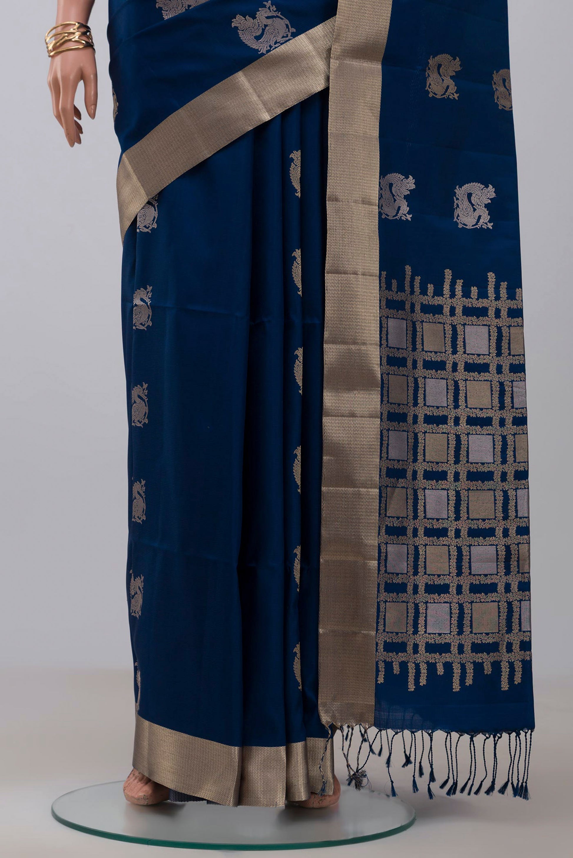 Pleats and pallu of Blue Soft Silk Saree with Zari Butta on the body and Zari Border. 