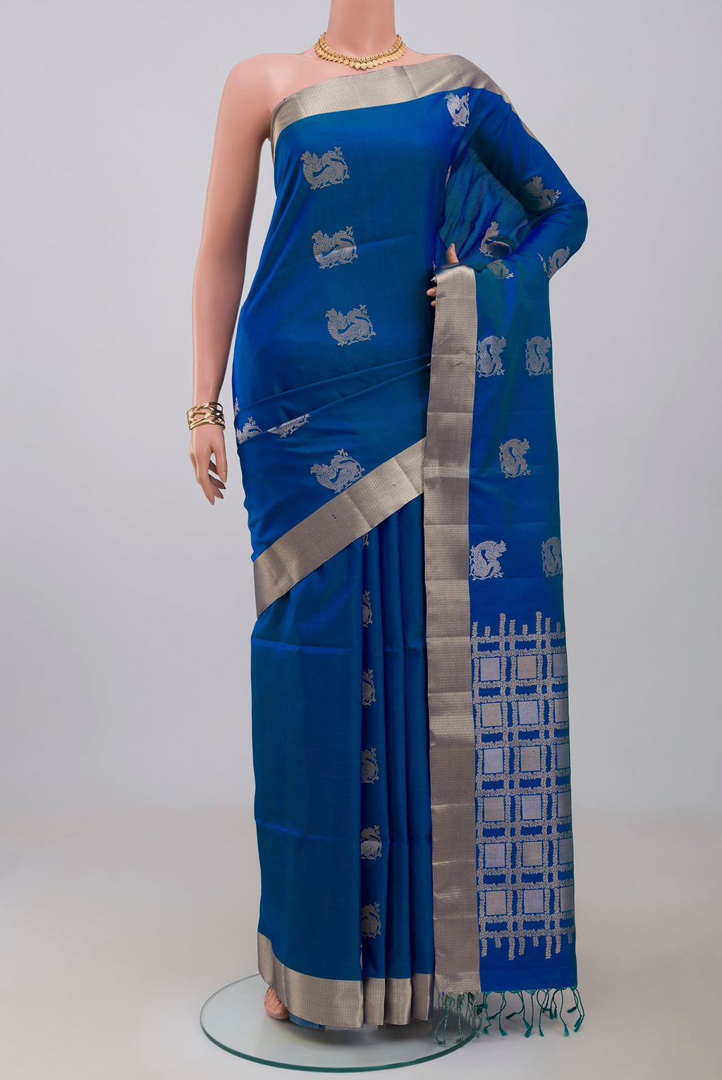 Blue Soft Silk Saree with Zari Butta on the body and Zari Border.  displayed on a mannequin