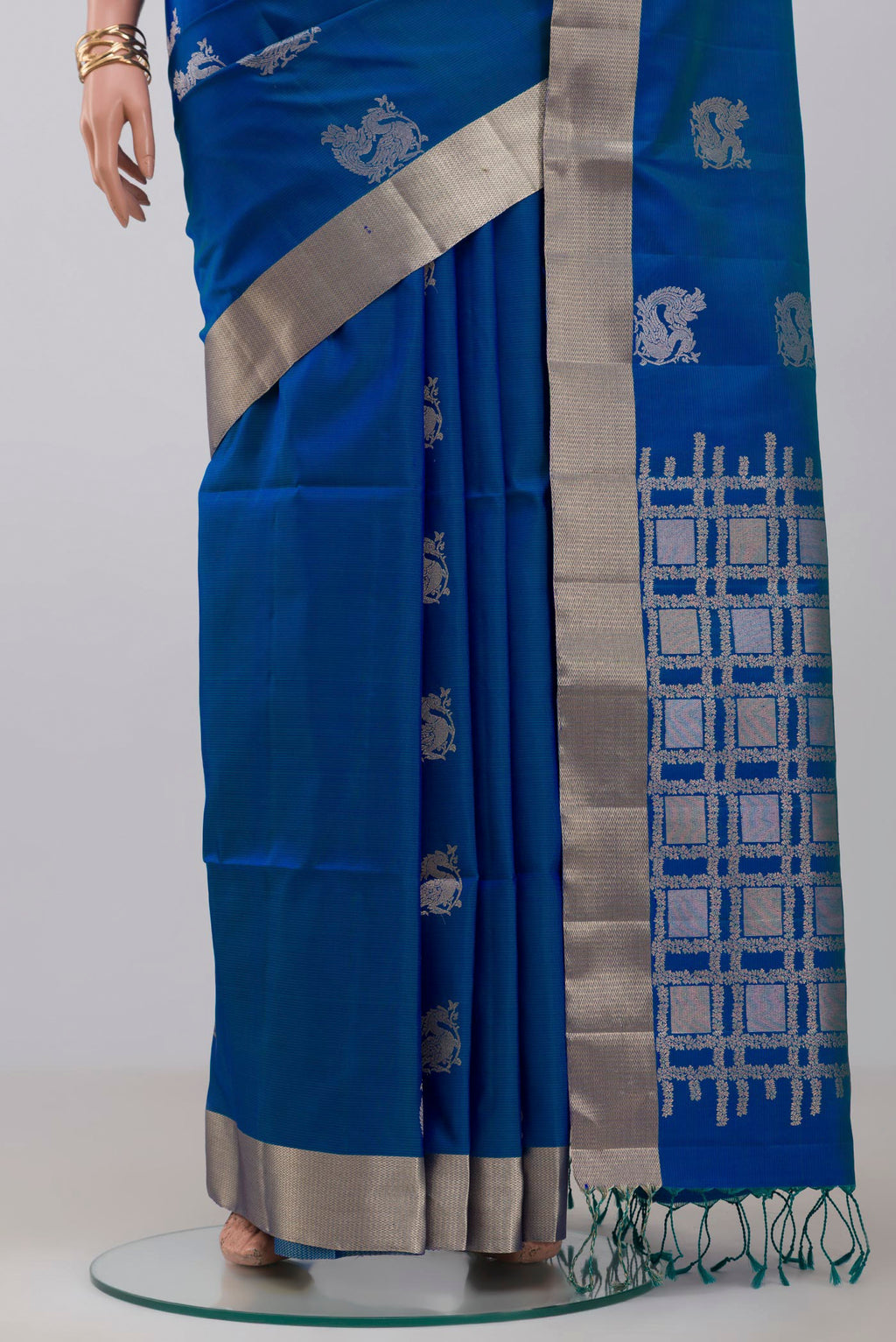 Pleats and pallu of Blue Soft Silk Saree with Zari Butta on the body and Zari Border. 
