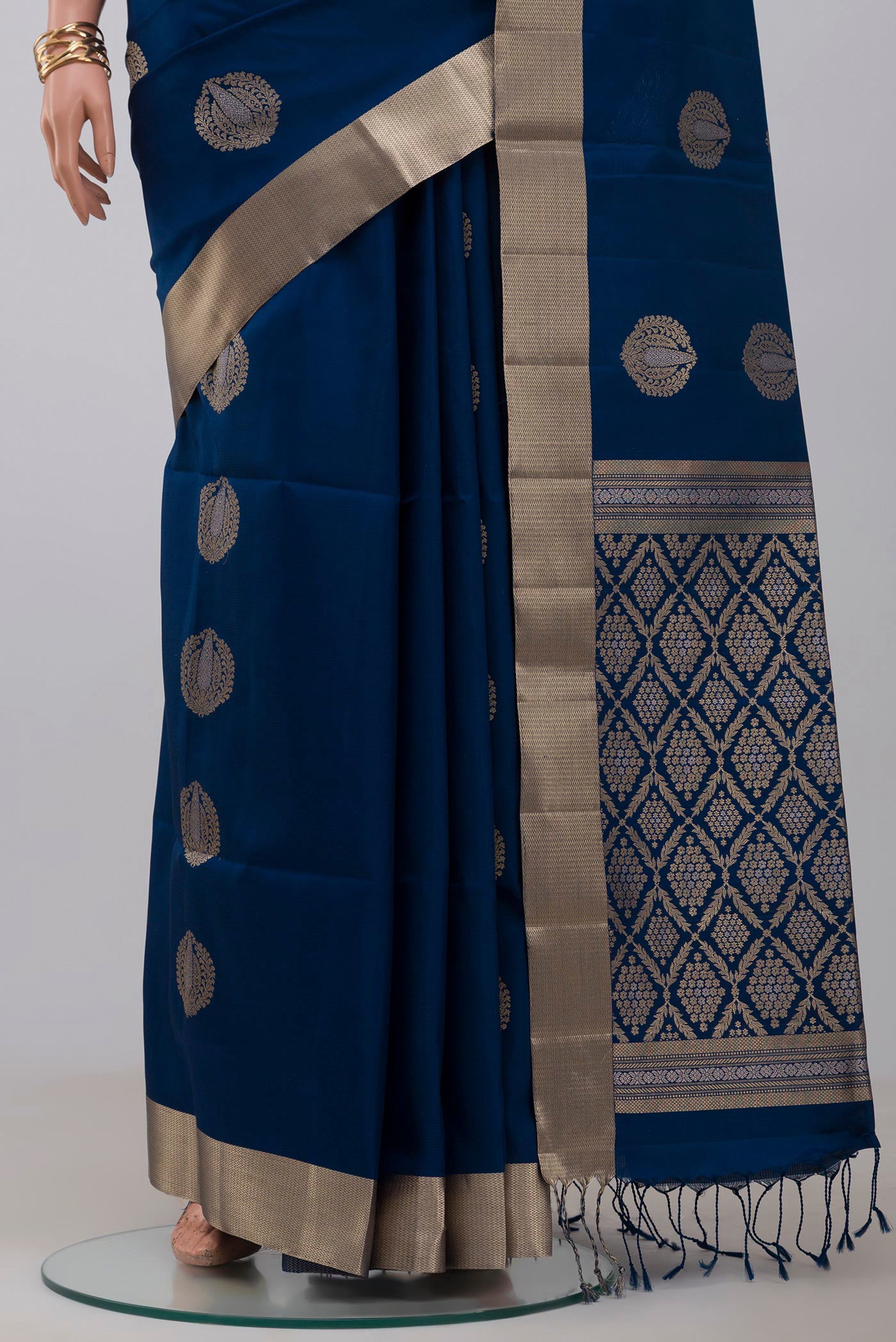 Pleats and pallu of Blue Soft Silk Saree with Zari Butta on the body and Zari Border. 